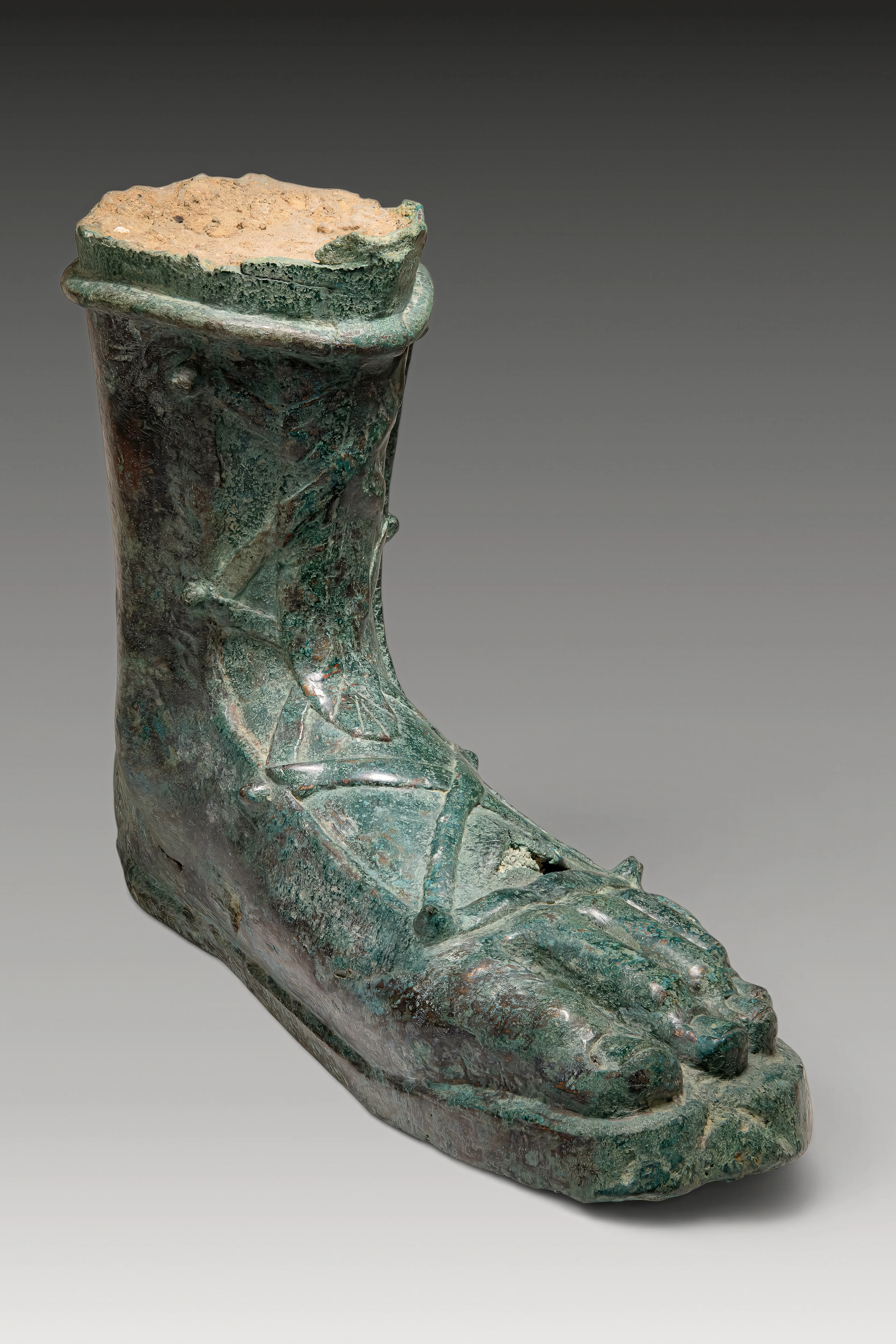 LIFE-SIZE ROMAN BRONZE FOOT FROM A STATUE OF AN EMPEROR OR GENERAL