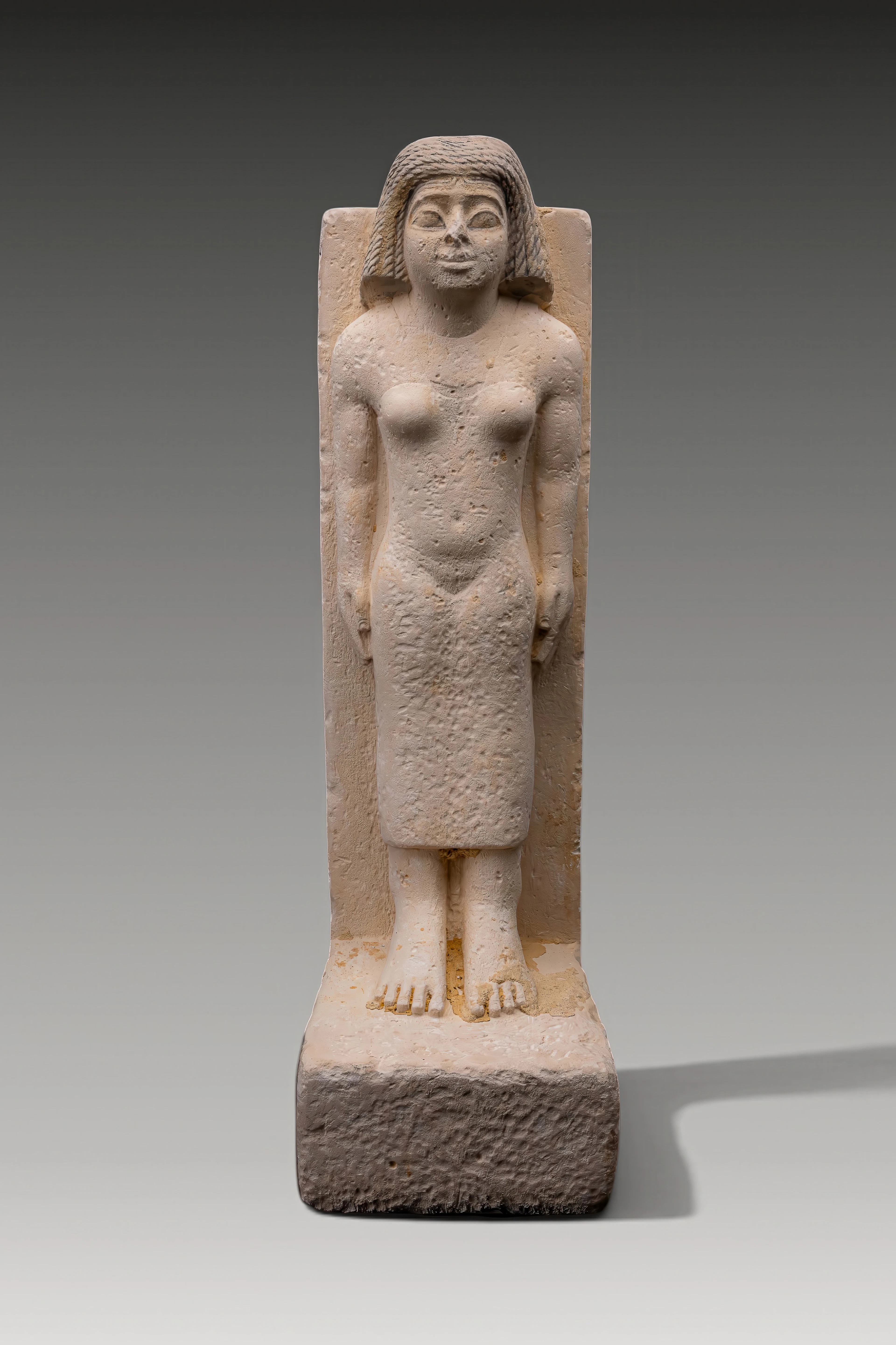 EGYPTIAN SANDSTONE STATUE OF A STANDING WOMAN