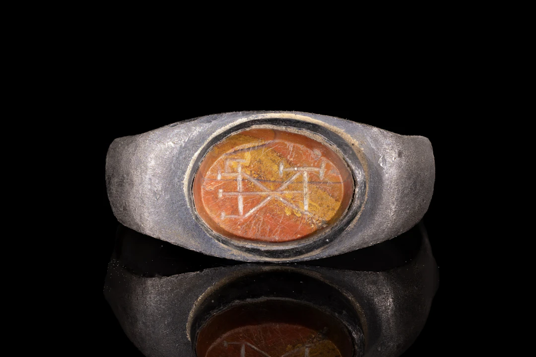 LATE ROMAN JASPER INTAGLIO WITH MONOGRAM IN SILVER RING