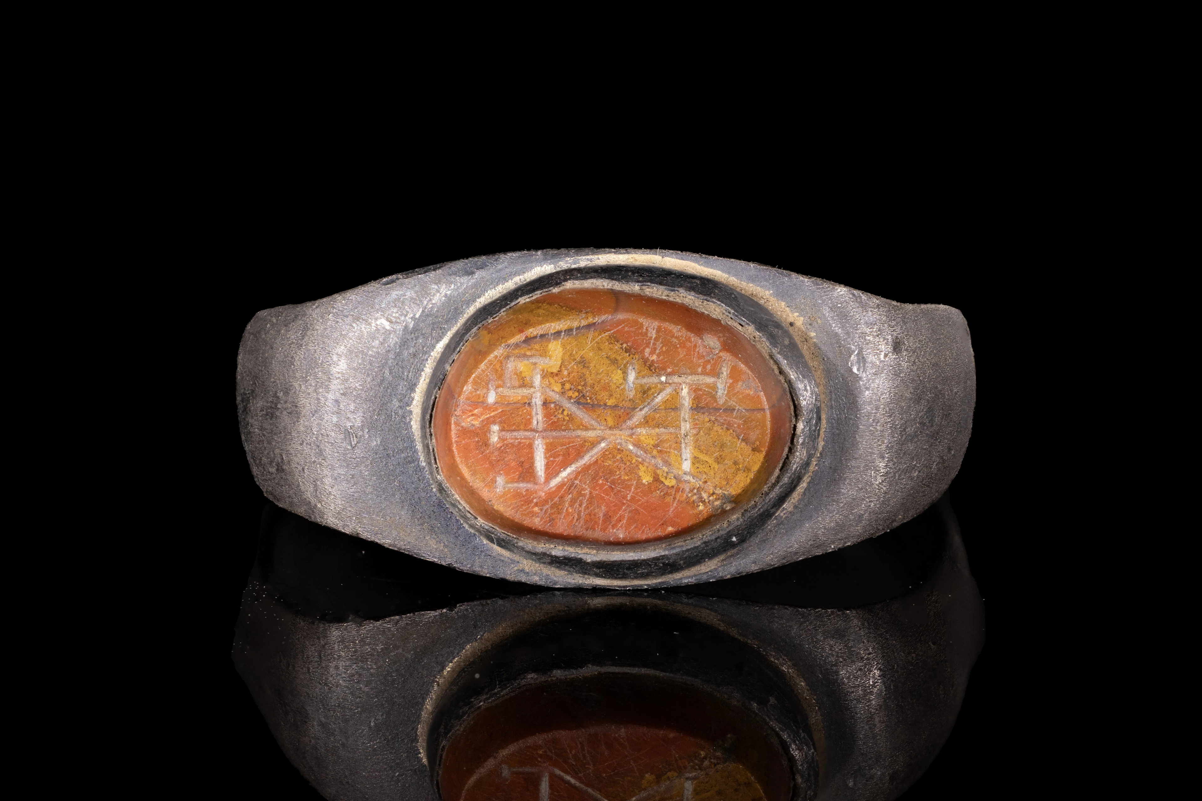 LATE ROMAN JASPER INTAGLIO WITH MONOGRAM IN SILVER RING