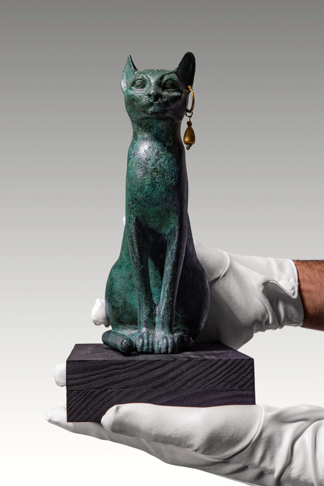 VERY LARGE EGYPTIAN BRONZE FIGURE OF A CAT, SACRED TO BASTET, WITH GOLD EARRING