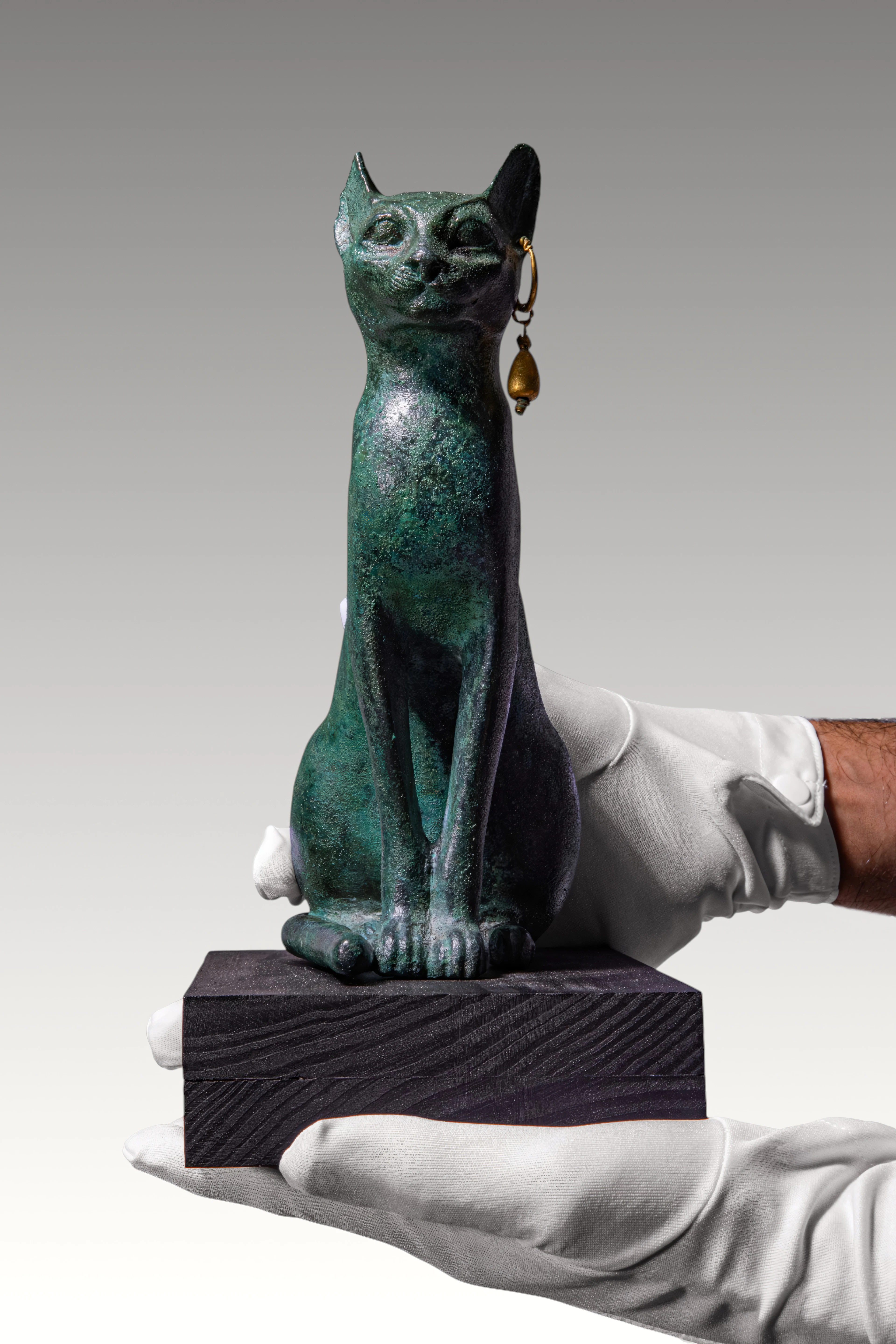 VERY LARGE EGYPTIAN BRONZE FIGURE OF A CAT, SACRED TO BASTET, WITH GOLD EARRING