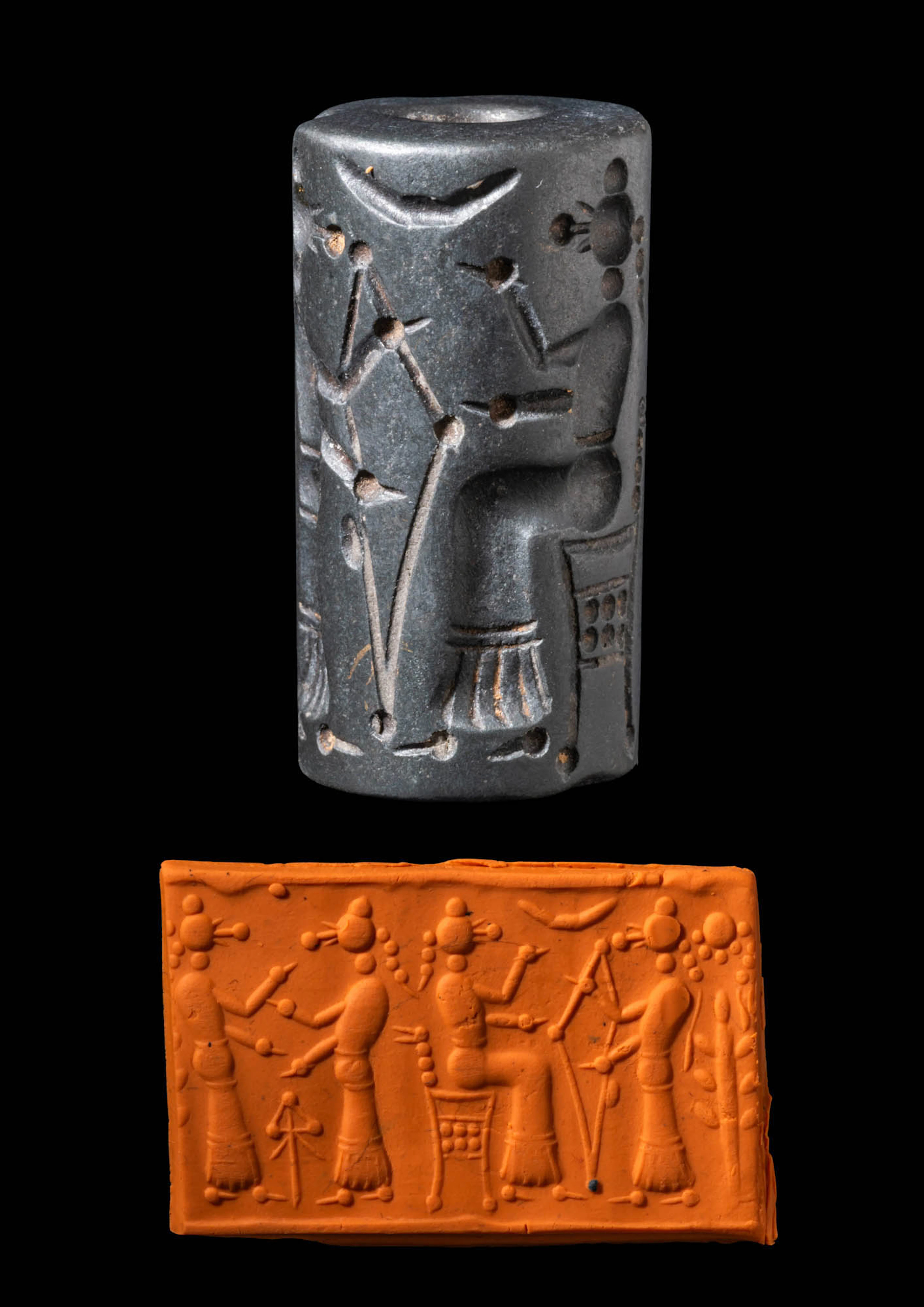 CYPRIOT OR EAST ANATOLIAN BLACKISH STONE CYLINDER SEAL WITH BIRD-FACED FIGURES
