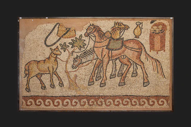LATE ROMAN MOSAIC PANEL WITH HORSES AND GEOMETRIC FRAME MOTIF