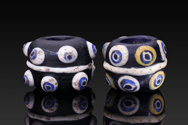 PAIR OF MASSIVE PHOENICIAN GLASS EYE BEADS