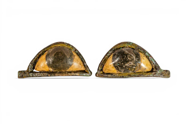 PAIR OF EGYPTIAN BRONZE AND STONE SARCOPHAGUS EYES