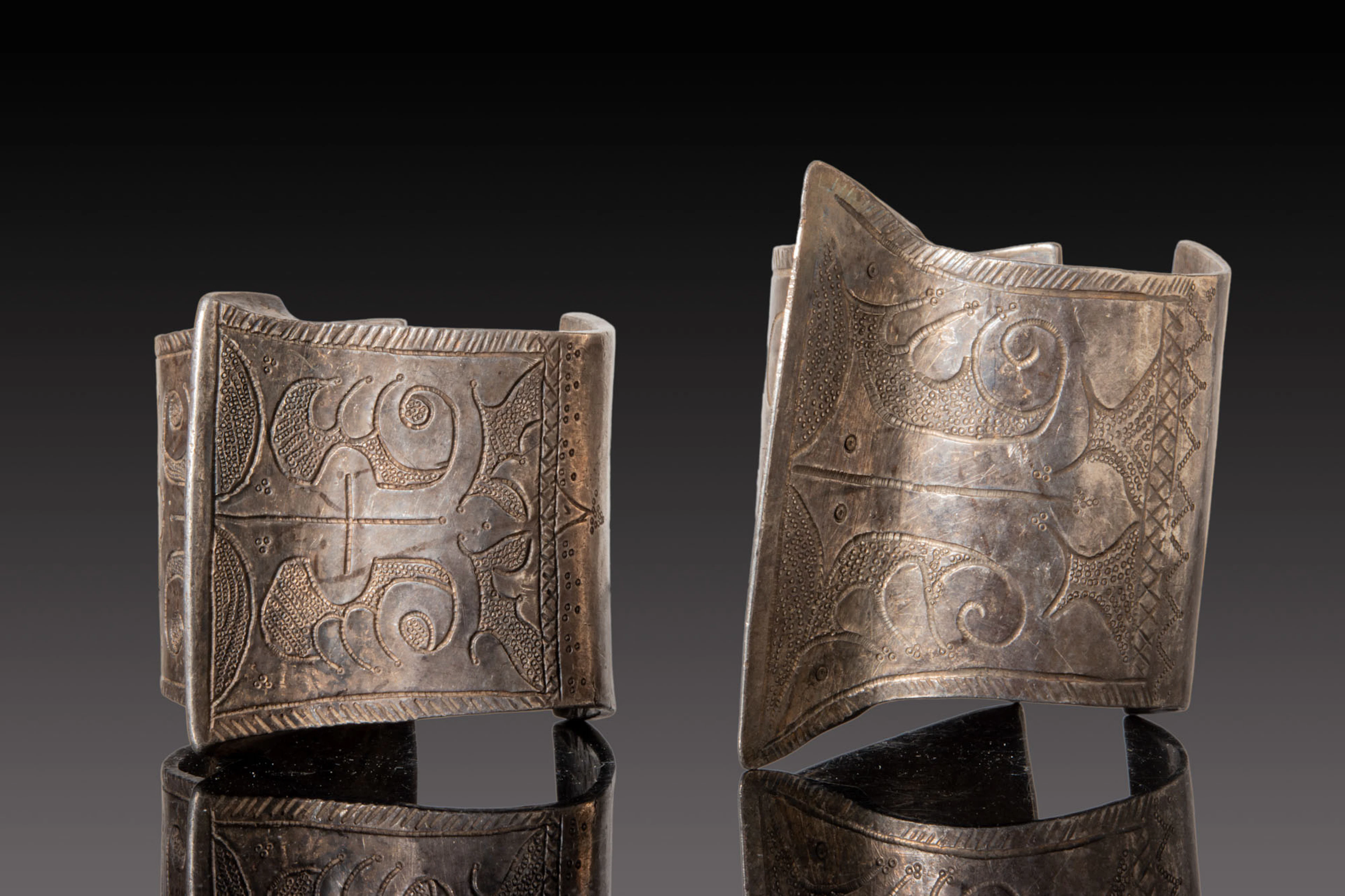 PAIR OF SELJUK SILVER BRACELETS WITH GEOMETRIC AND FLORAL MOTIFS