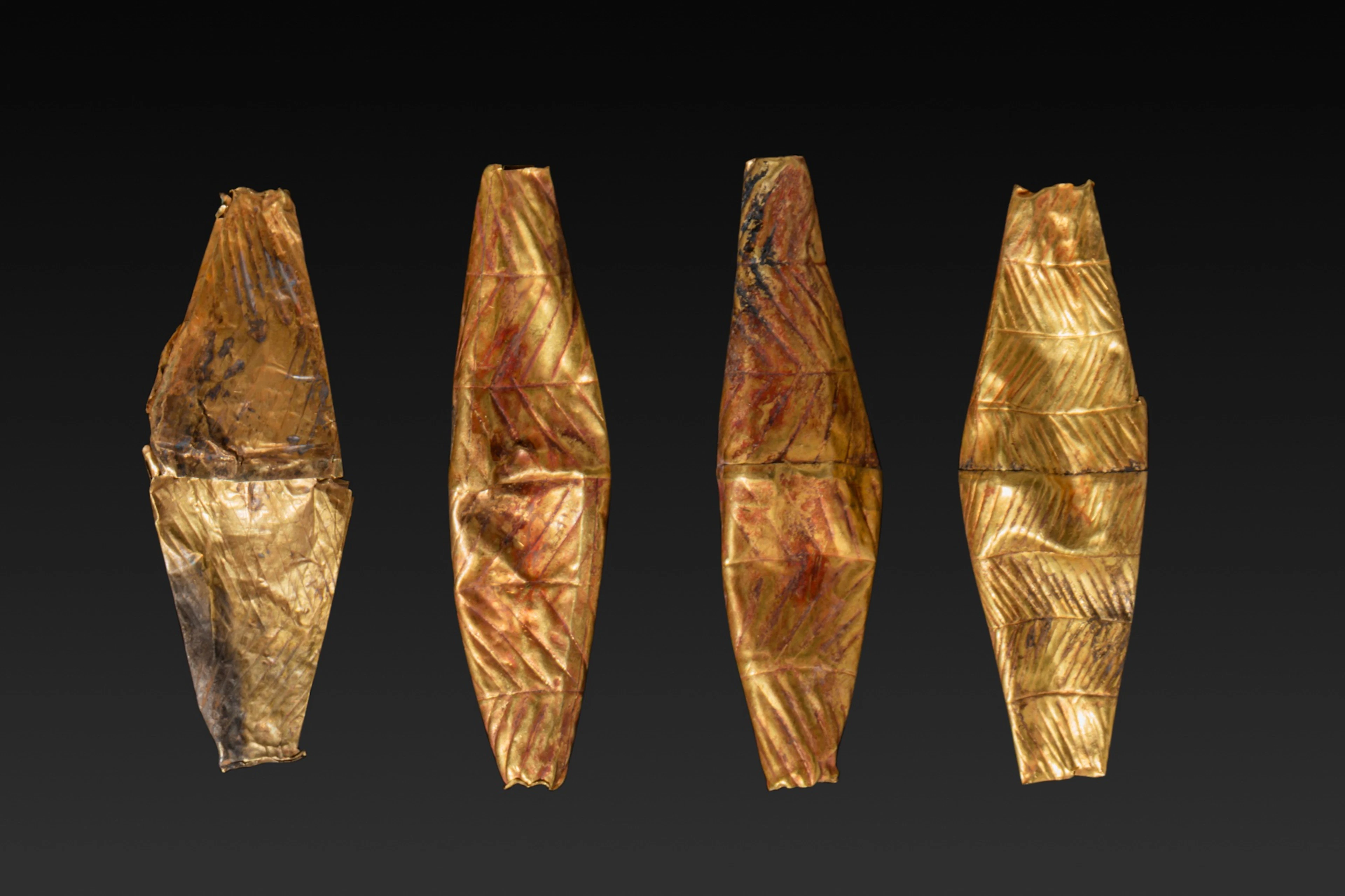 COLLECTION OF FOUR LARGE GREEK GEOMETRIC HIGH KARAT GOLD BICONICAL