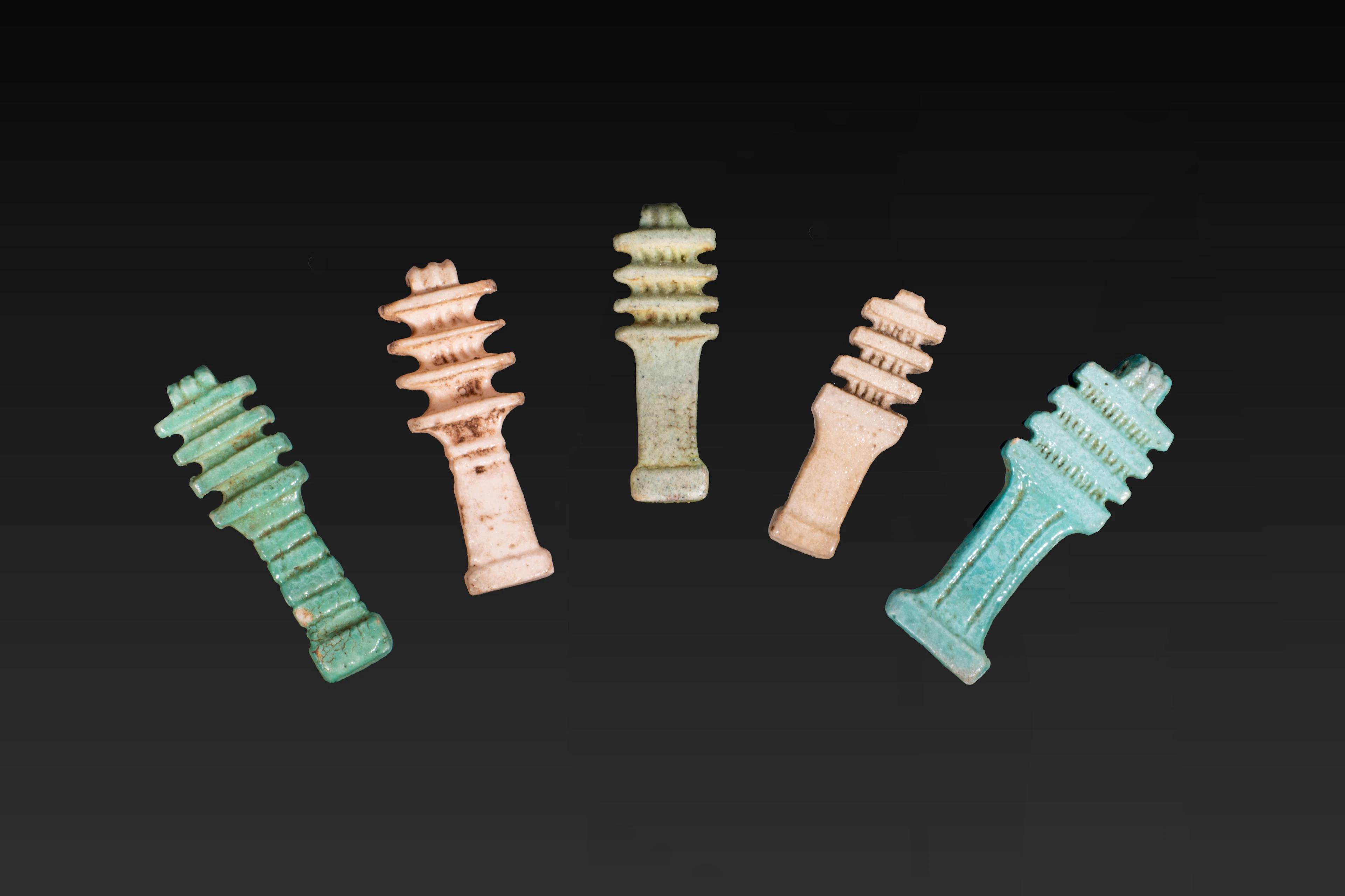 COLLECTION OF EGYPTIAN FAIENCE DJED PILLAR AMULETS