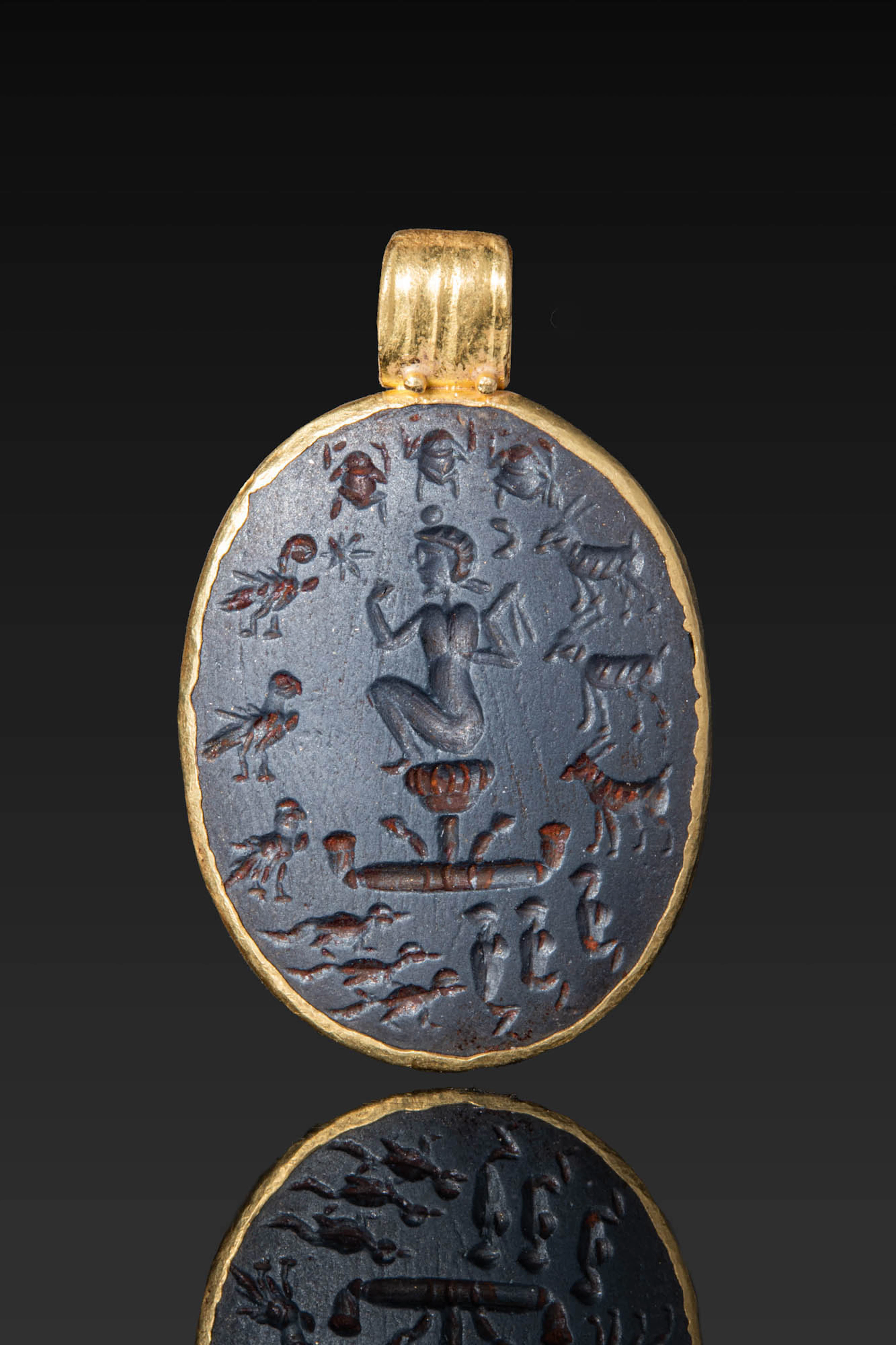 ROMAN HAEMATITE MAGICAL GEM WITH HARPOCRATES AND TRIADS OF ANIMALS