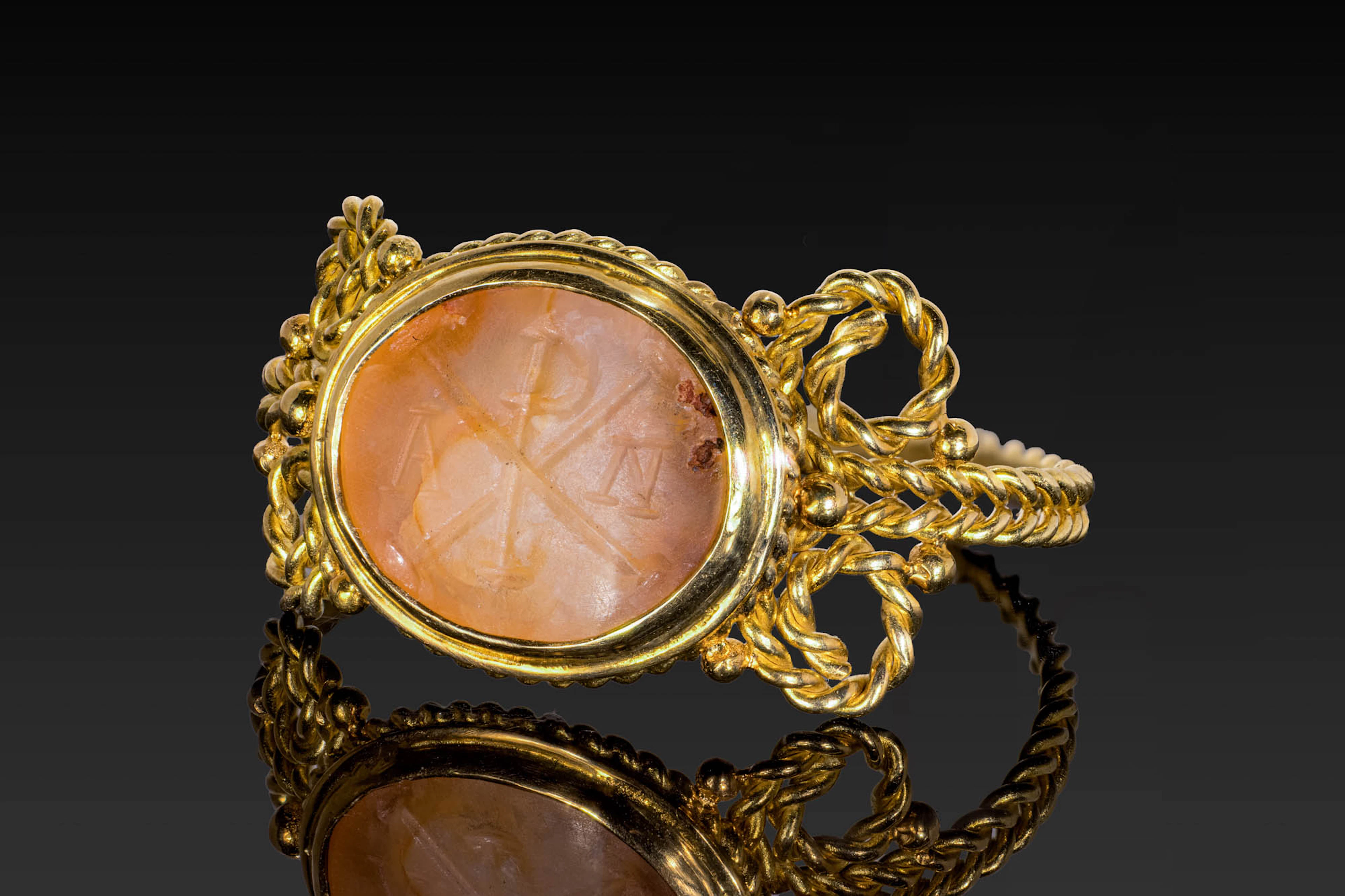 EARLY BYZANTINE PINK CHALCEDONY INTAGLIO WITH CHI-RHO MONOGRAM IN GOLD RING