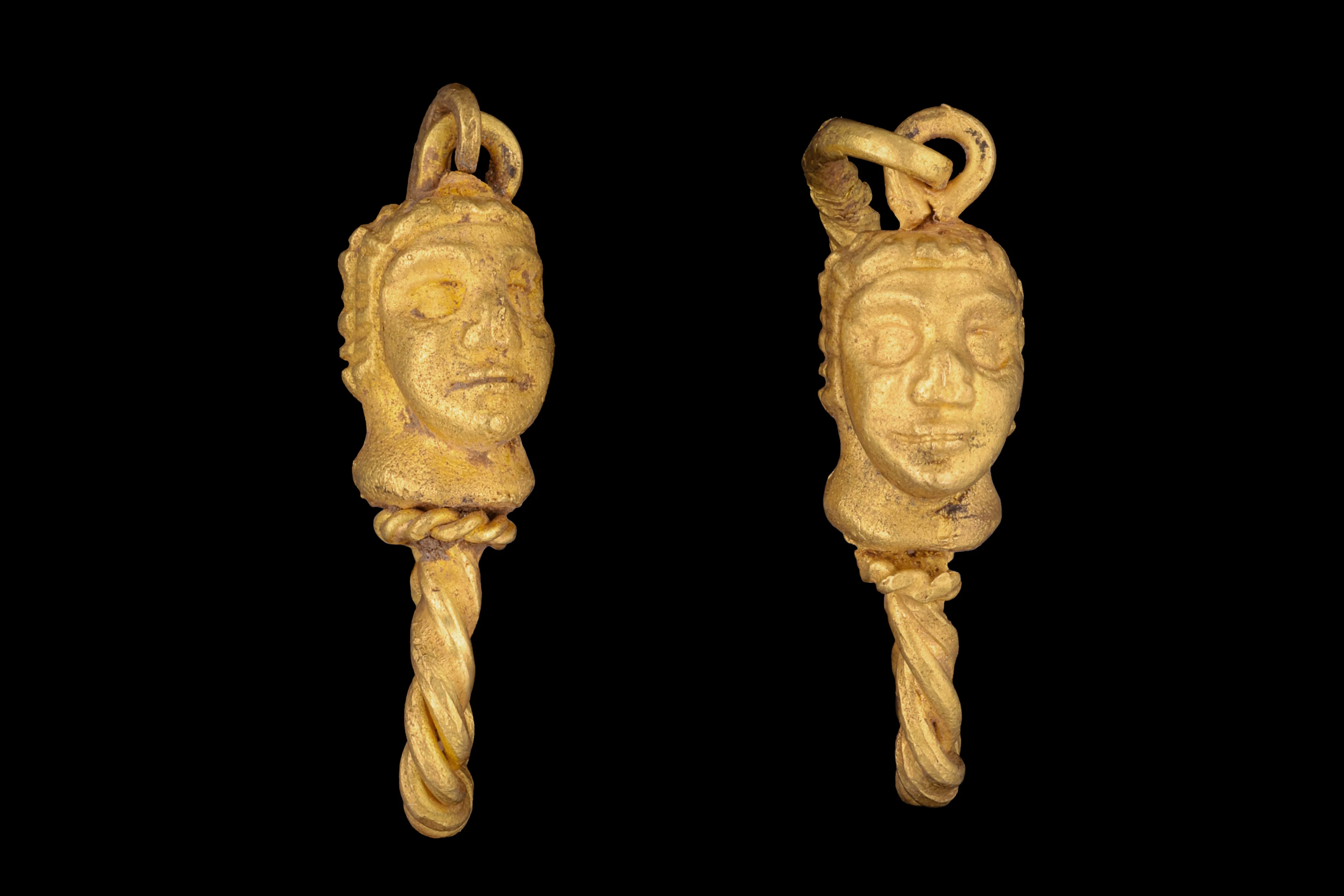 MATCHED PAIR OF HELLENISTIC GOLD EARRINGS WITH MALE HEADS
