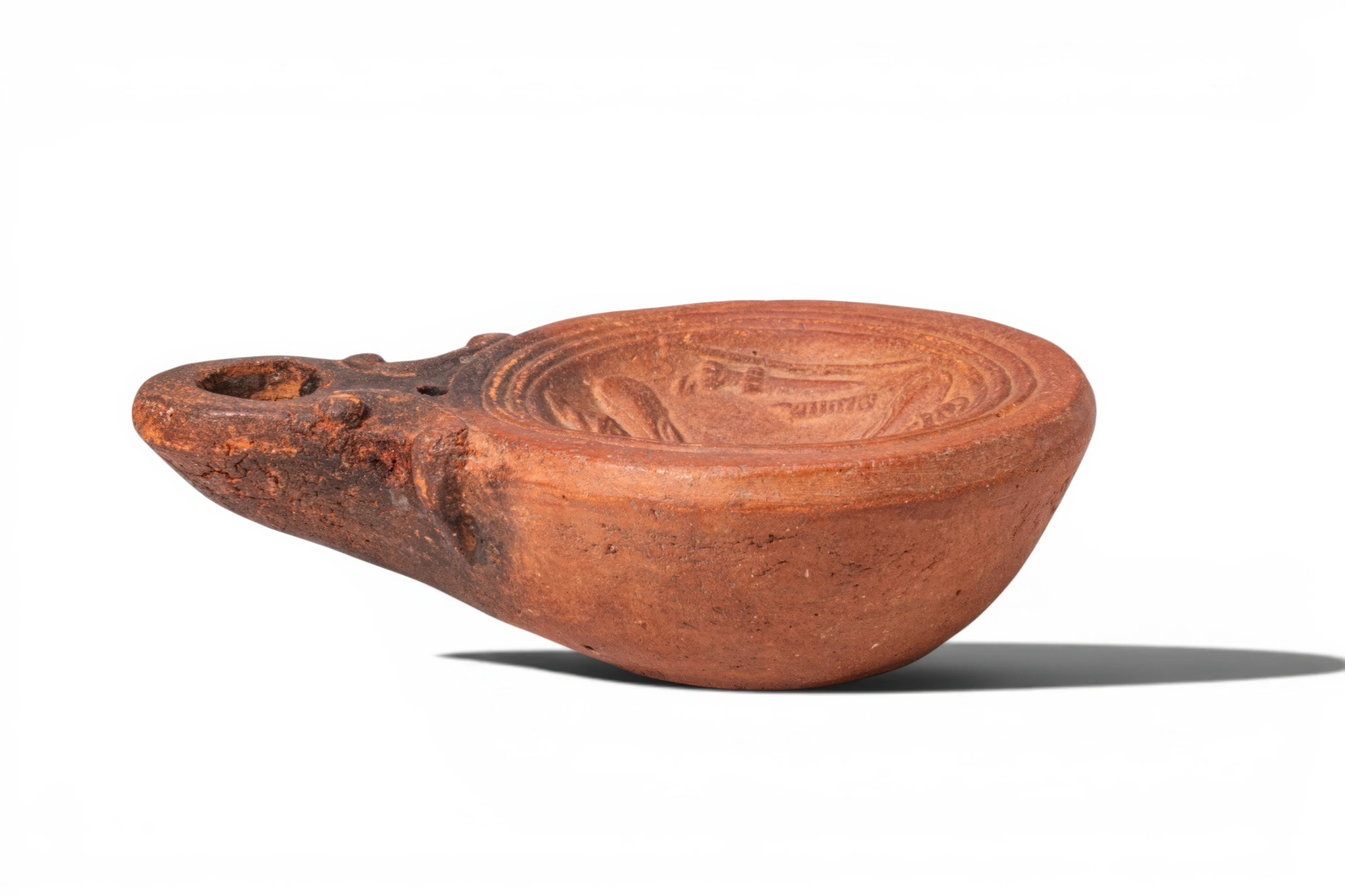 ROMAN TERRACOTTA OIL LAMP WITH GLADIATORIAL EQUIPMENT