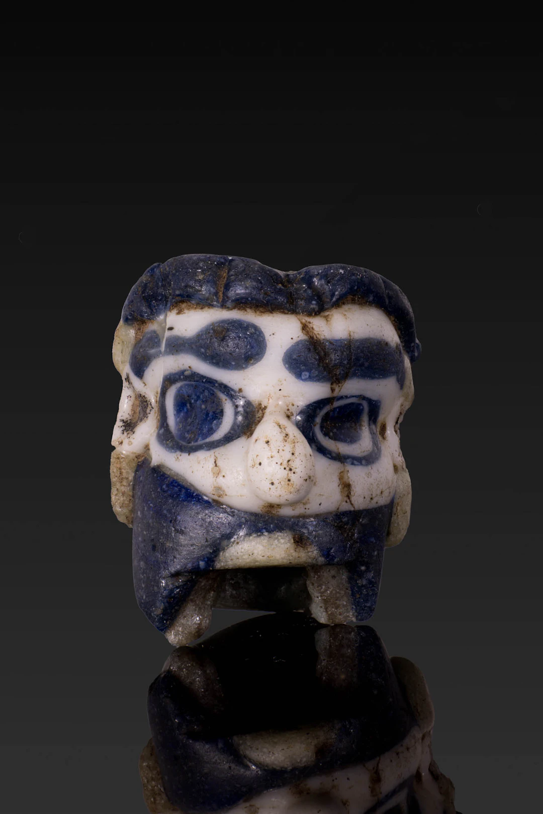 GRAECO-PHOENICIAN POLYCHROME GLASS FACE BEAD