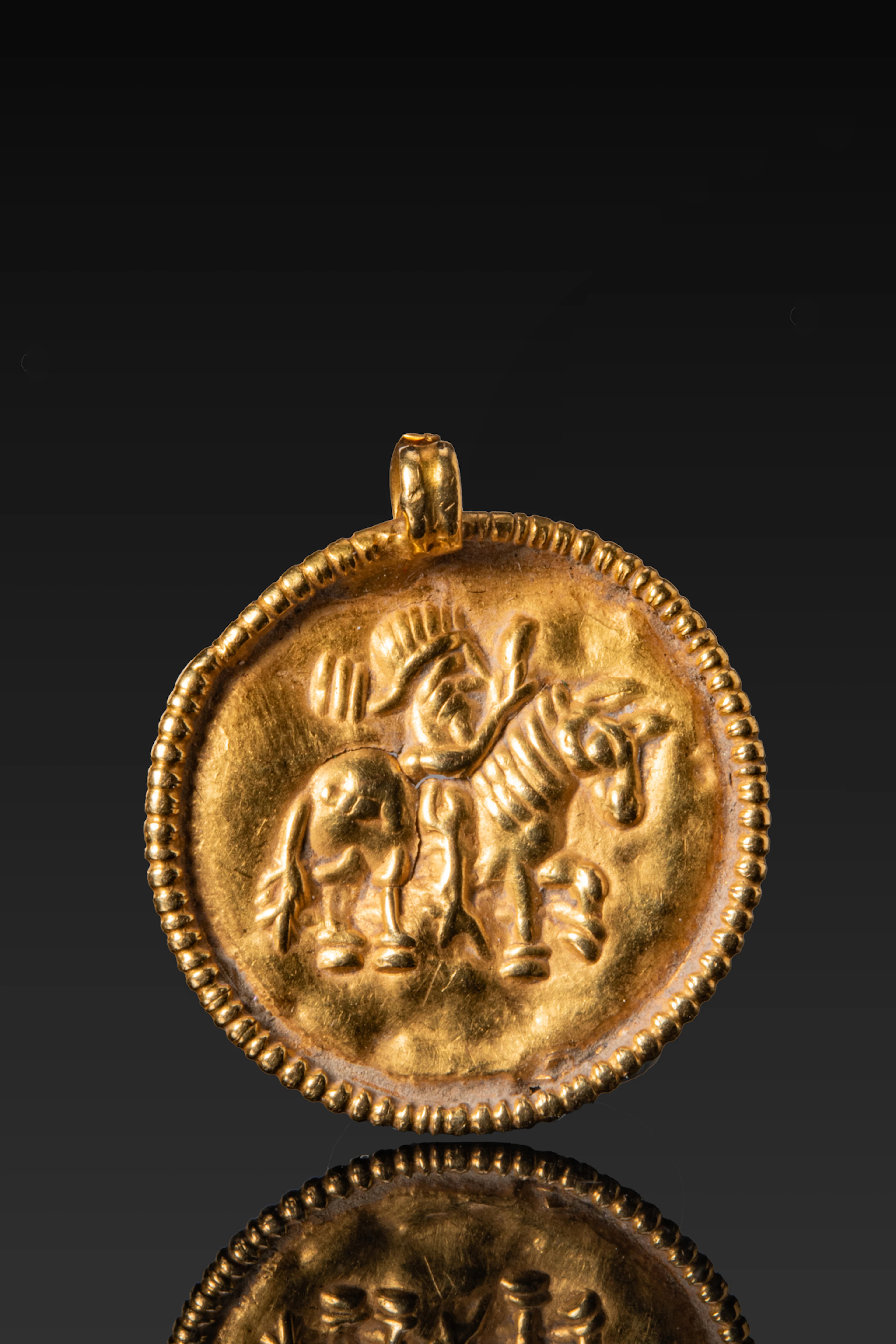 HELLENISTIC HIGH KARAT OLD SHEET PENDANT WITH HORSEMAN
