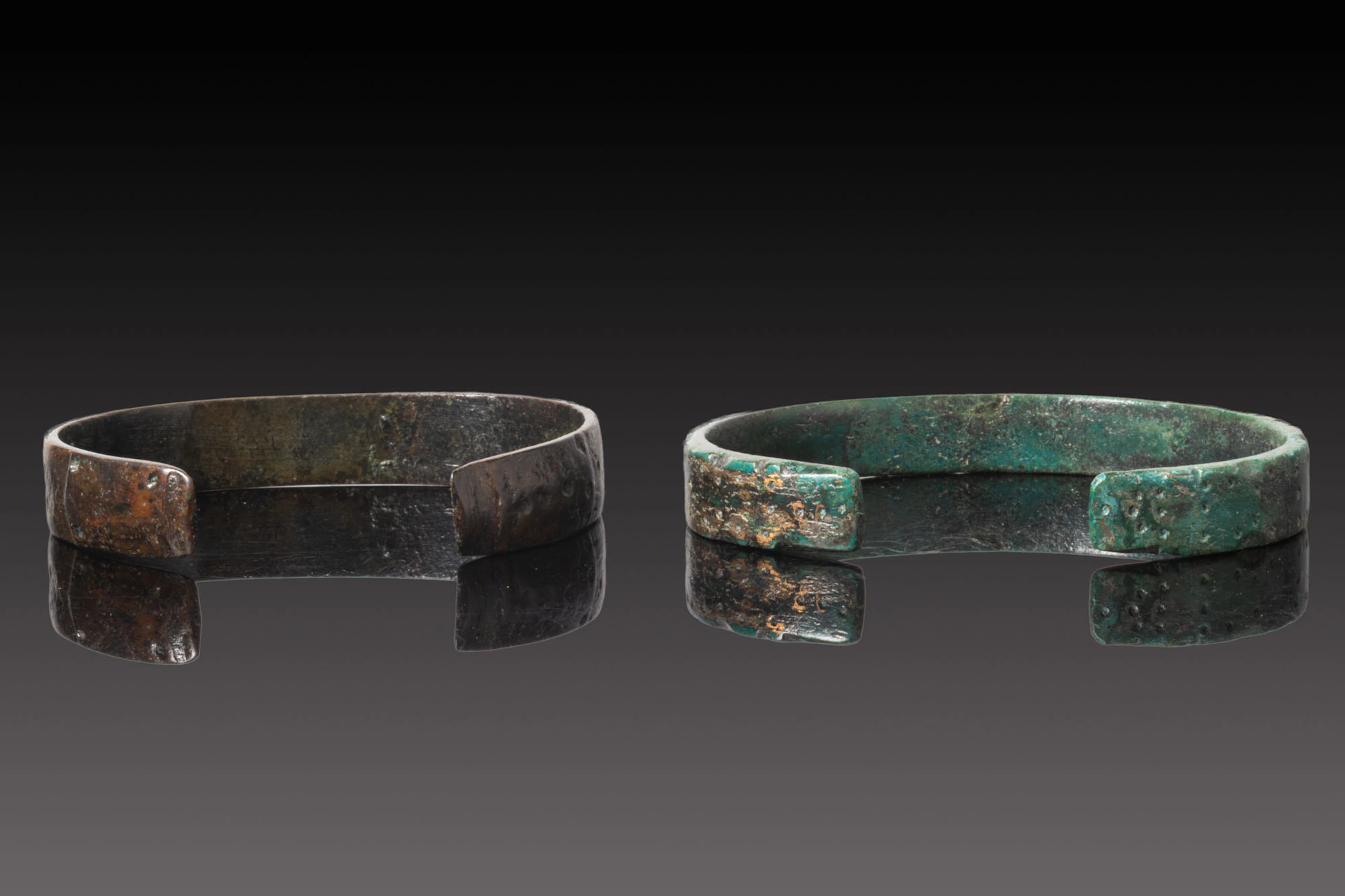 PAIR OF VIKING BRONZE DECORATED BRACELETS