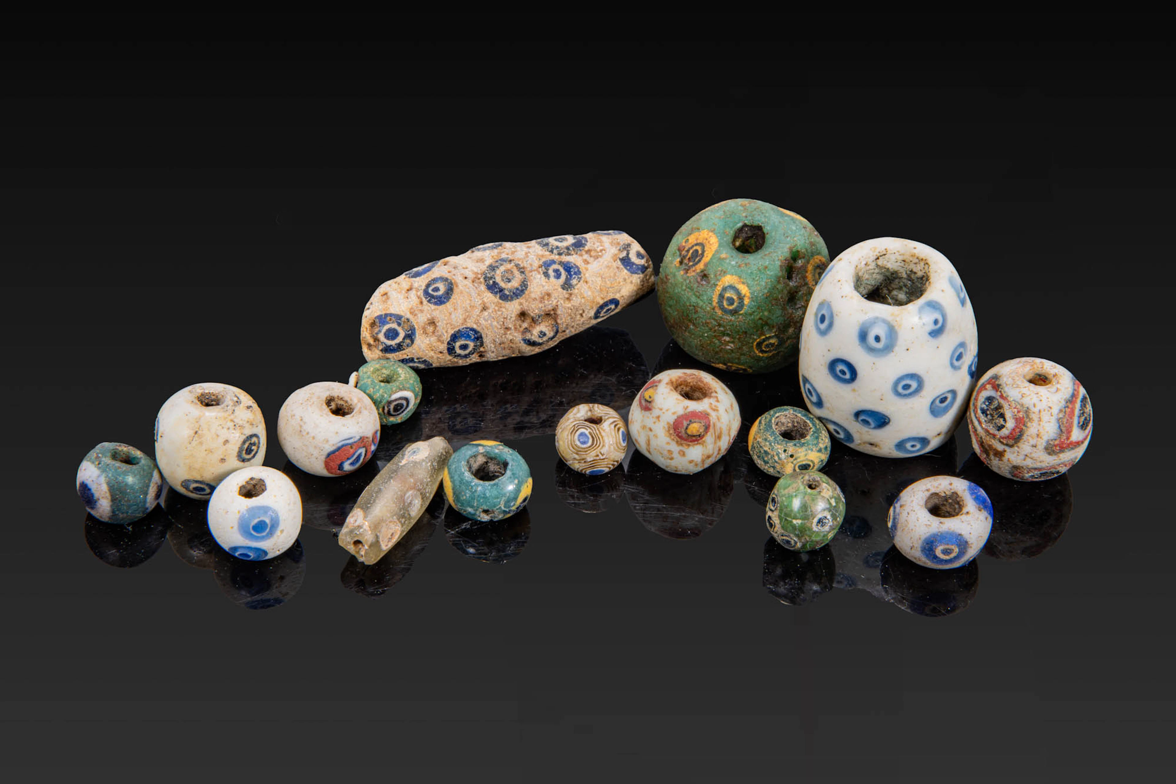 COLLECTION OF GRAECO-PHOENICIAN POLYCHROME GLASS BEADS