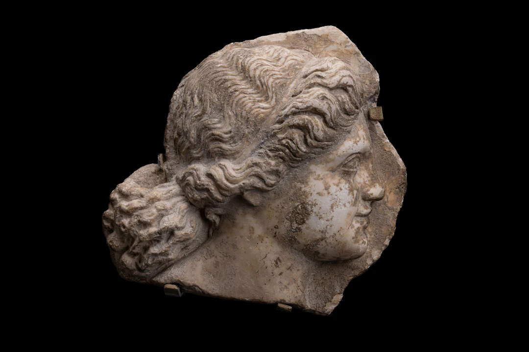 ROMAN BAS-RELIEF MARBLE PANEL OF A HEAD IN PROFILE