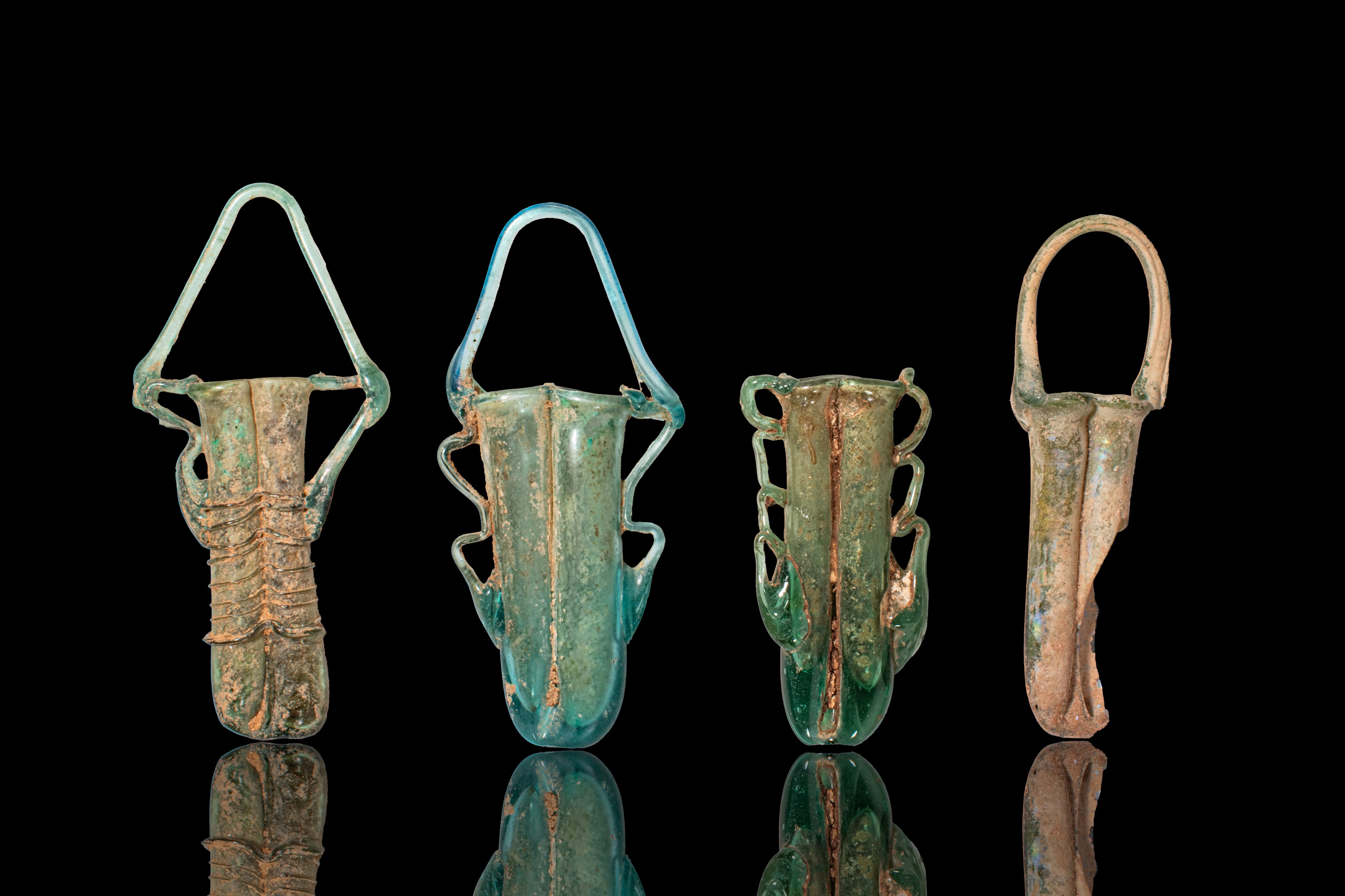 STUNNING COLLECTION OF LATE ROMAN GLASS DOUBLE UNGUENTARIA