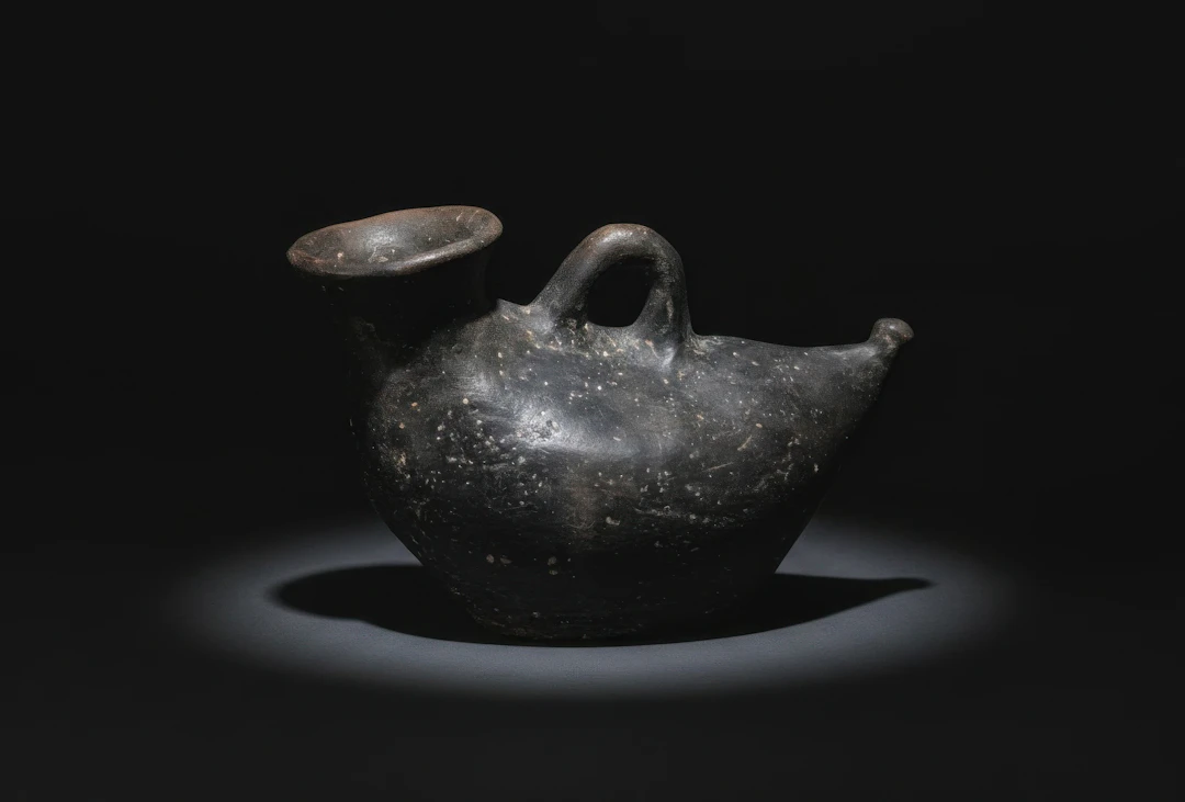 GREEK BLACK TERRACOTTA BIRD-SHAPED ASKOS