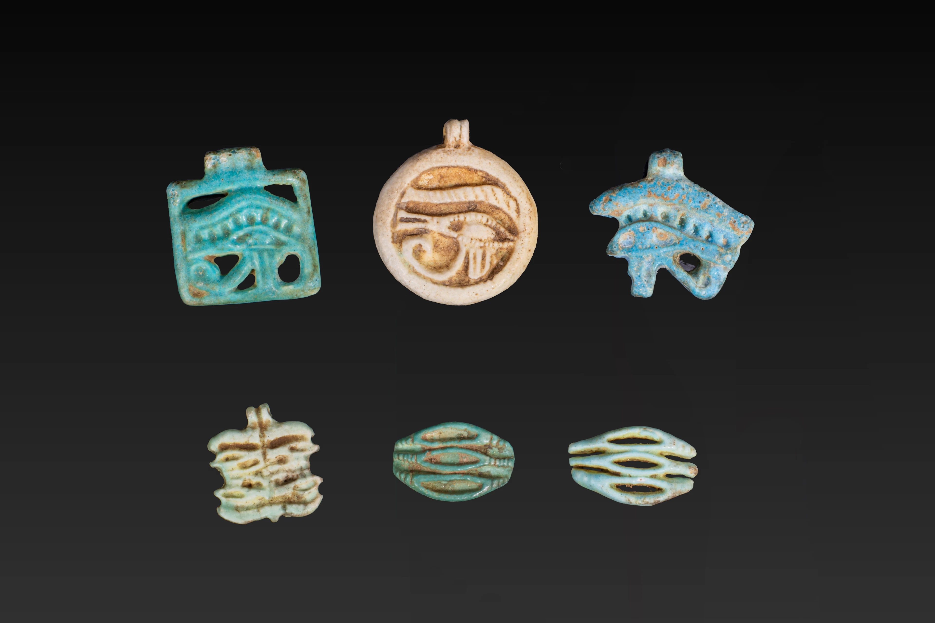 COLLECTION OF FAIENCE WADJET AMULETS