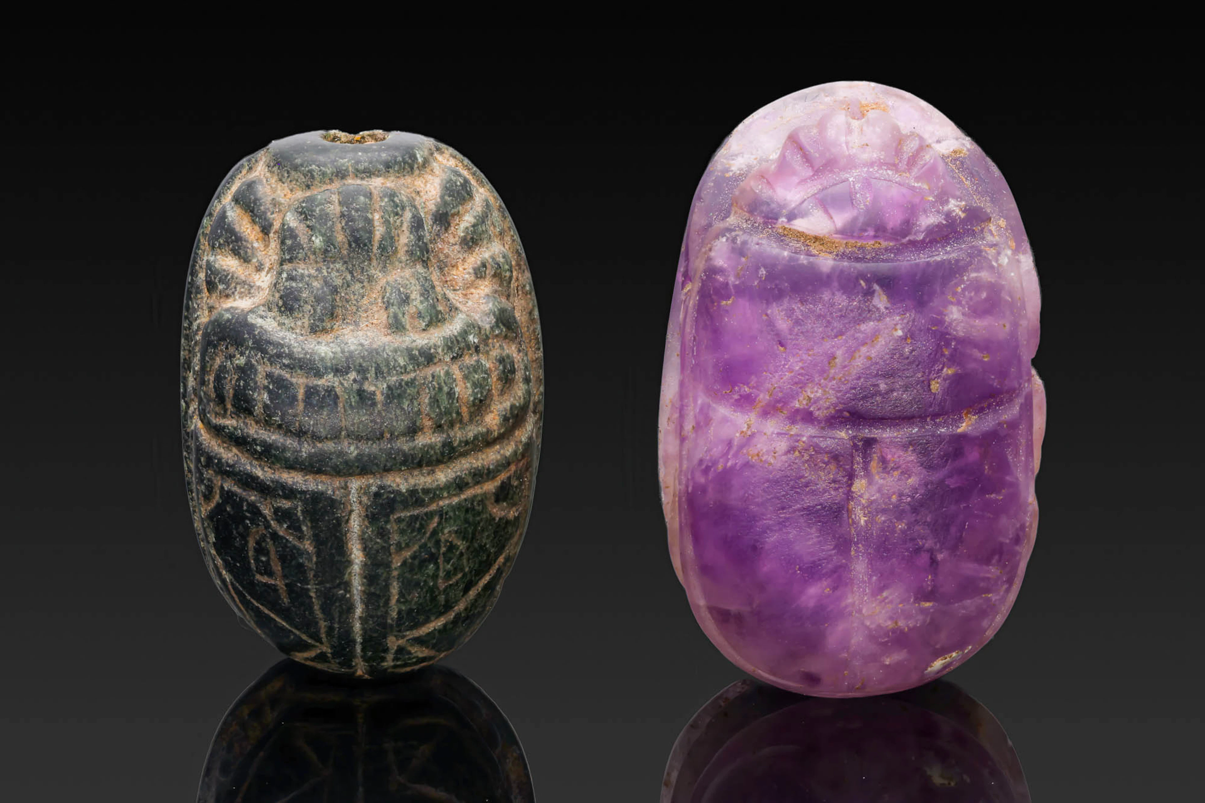 PAIR OF EGYPTIAN GREEN STONE AND AMETHYST SCARABS