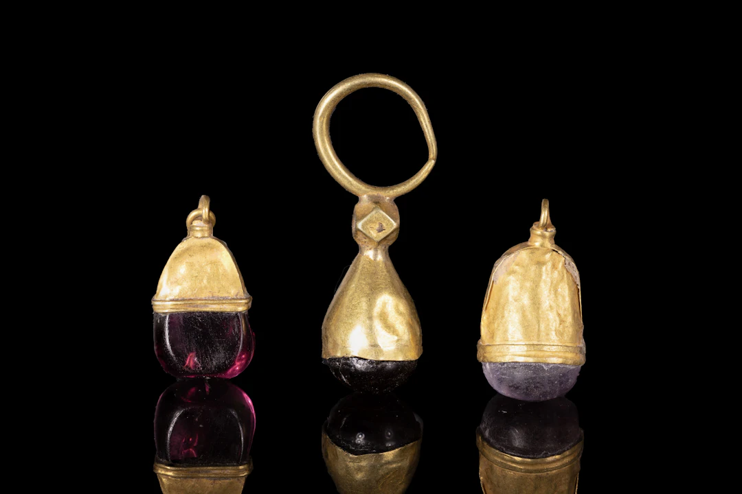 COLLECTION OF GREEK GOLD AND GEMSTONE PENDANTS