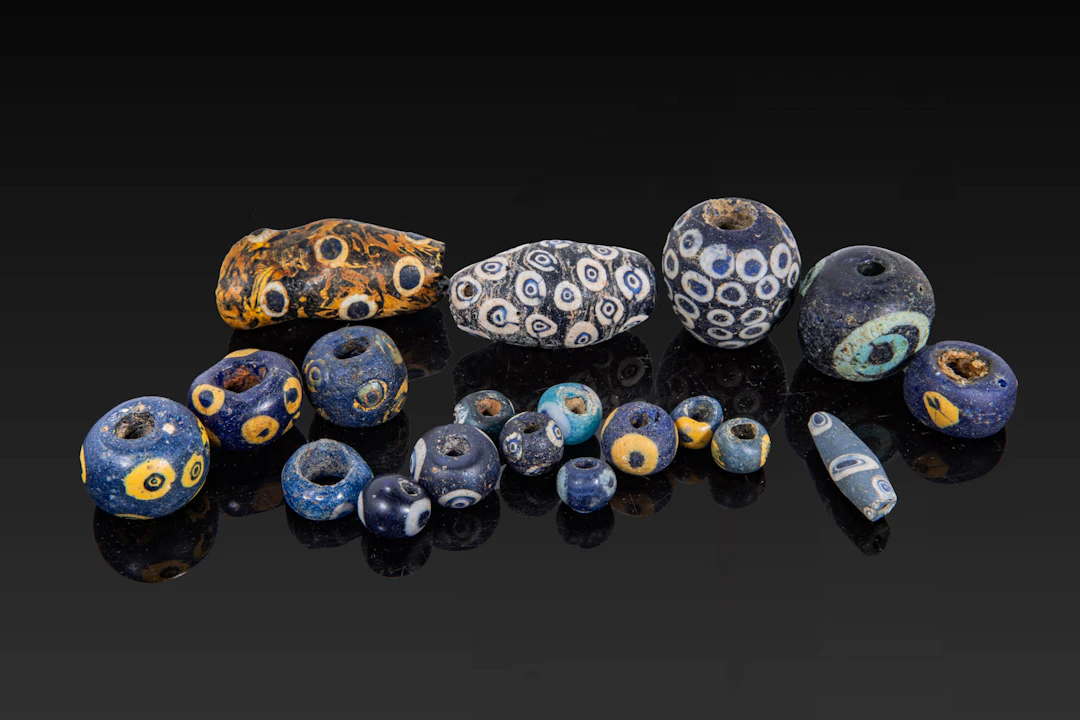 COLLECTION OF GRAECO-PHOENICIAN POLYCHROME GLASS BEADS