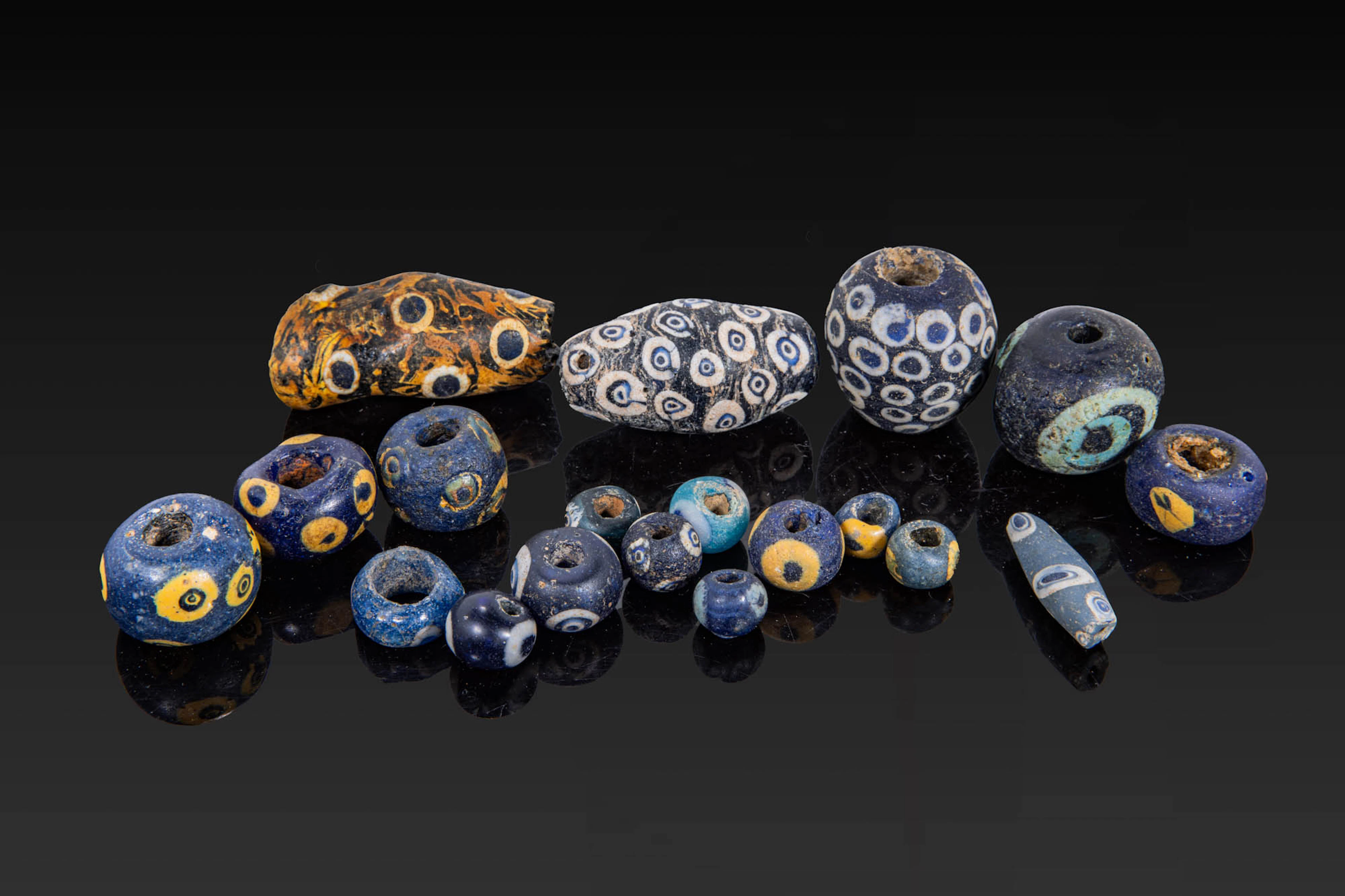 COLLECTION OF GRAECO-PHOENICIAN POLYCHROME GLASS BEADS