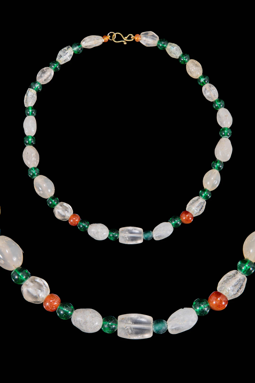 HELLENISTIC ROCK CRYSTAL, GREEN GLASS AND CARNELIAN BEAD NECKLACE