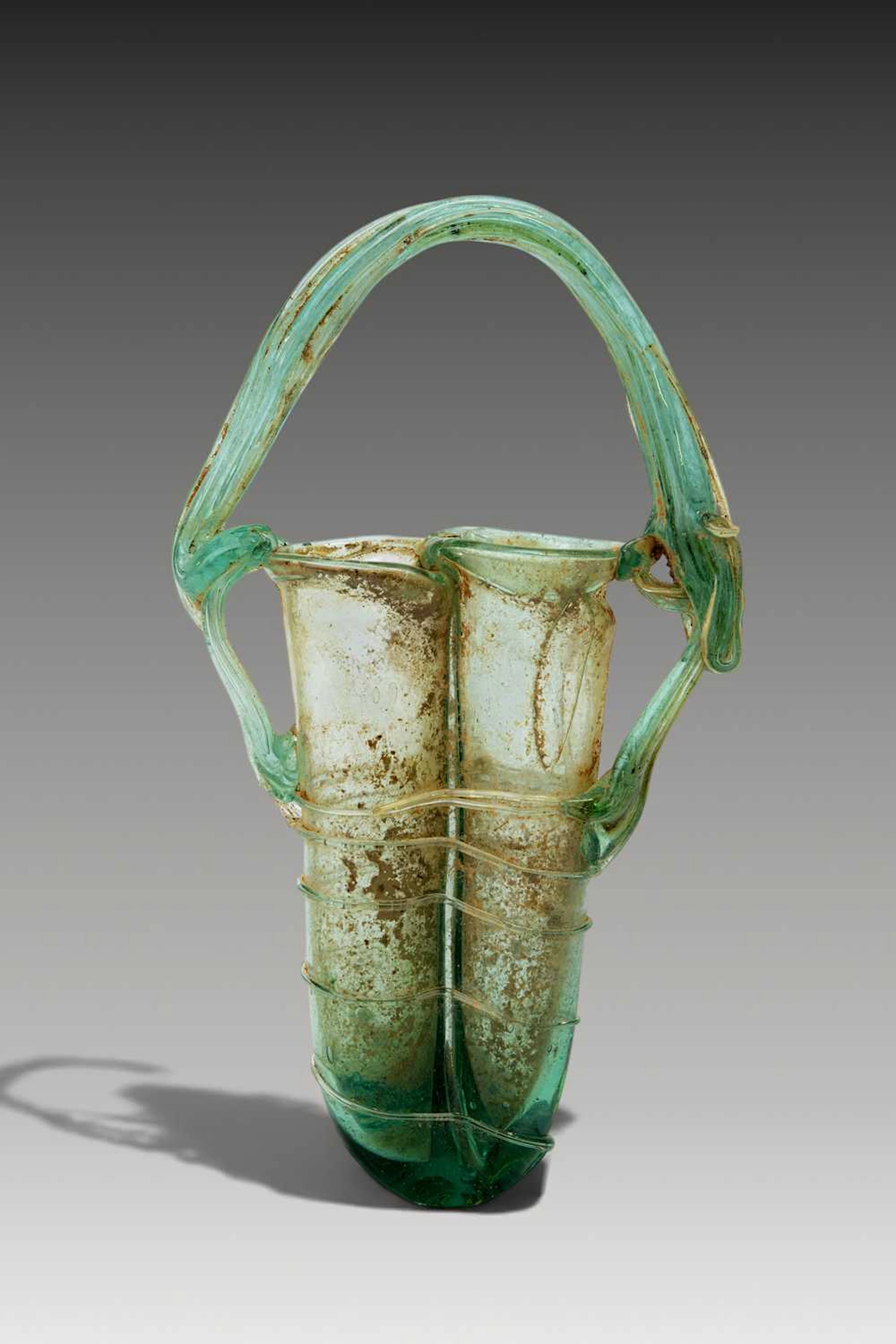 ROMAN GLASS DOUBLE UNGUENTARIUM WITH GLASS THREAD DECORATION