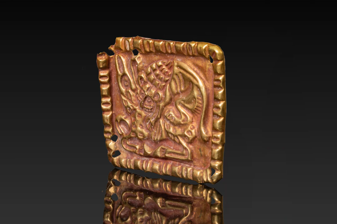 SCYTHIAN REPOUSSÉ HIGH KARAT GOLD PLAQUE WITH LION AND DEER