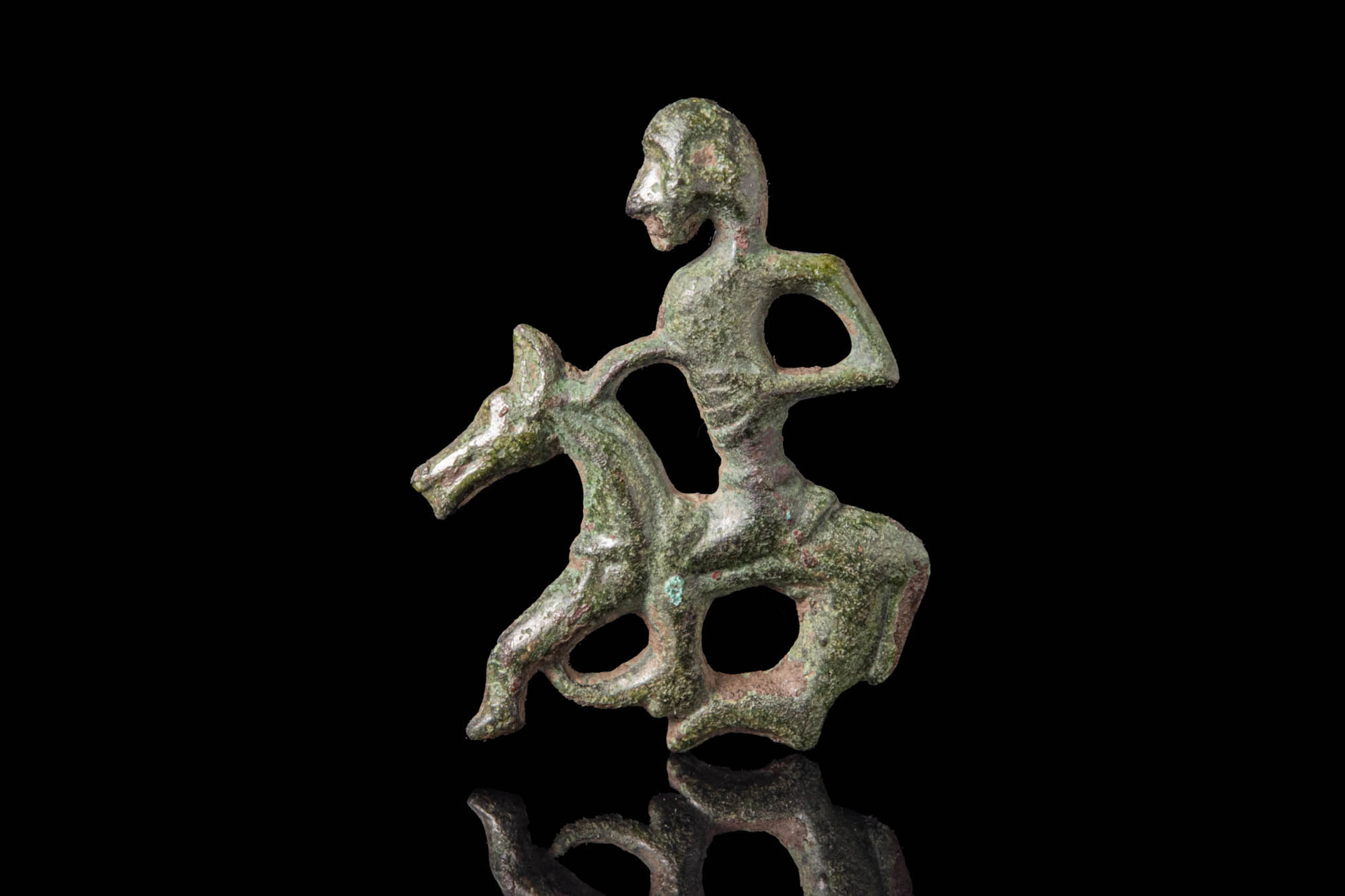 VIKING BRONZE OPENWORK APPLIQUÉ IN THE FORM OF A HORSE AND RIDER