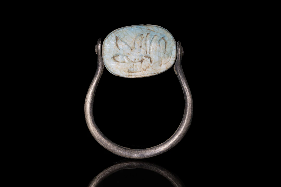 EGYPTIAN FAIENCE SCARAB INSCRIBED "KING OF UPPER AND LOWER EGYPT"