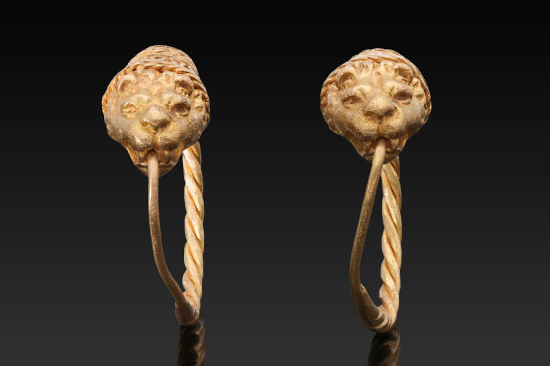 MATCHED PAIR OF HELLENISTIC GOLD EARRINGS WITH LION HEADS