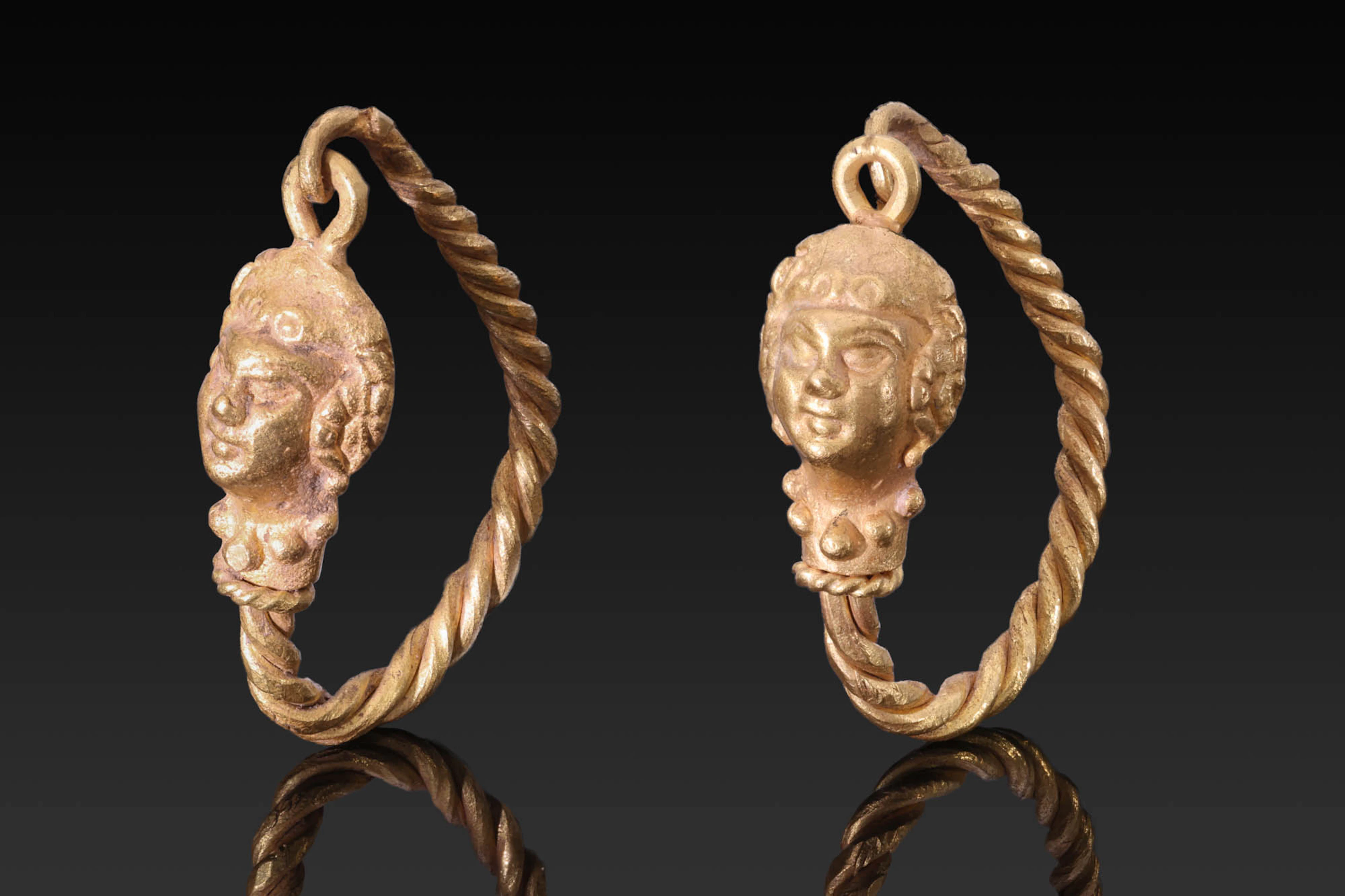 MATCHED PAIR OF HELLENISTIC GOLD EARRINGS WITH LION HEADS