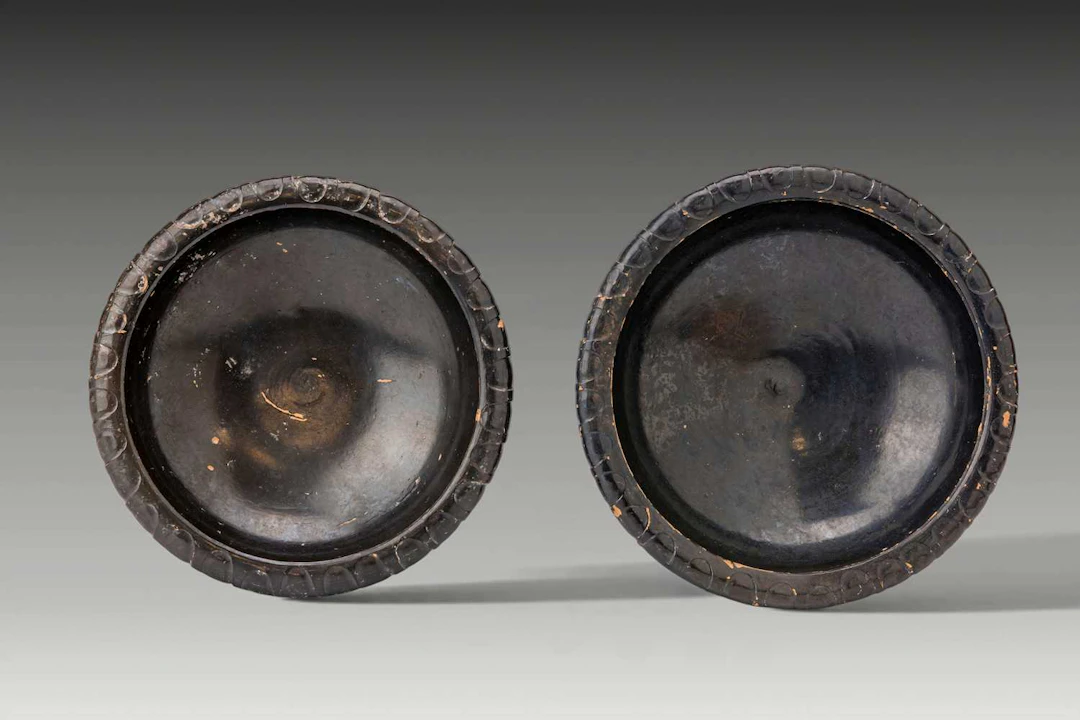 PAIR OF GREEK BLACK-GLAZED SHALLOW BOWLS