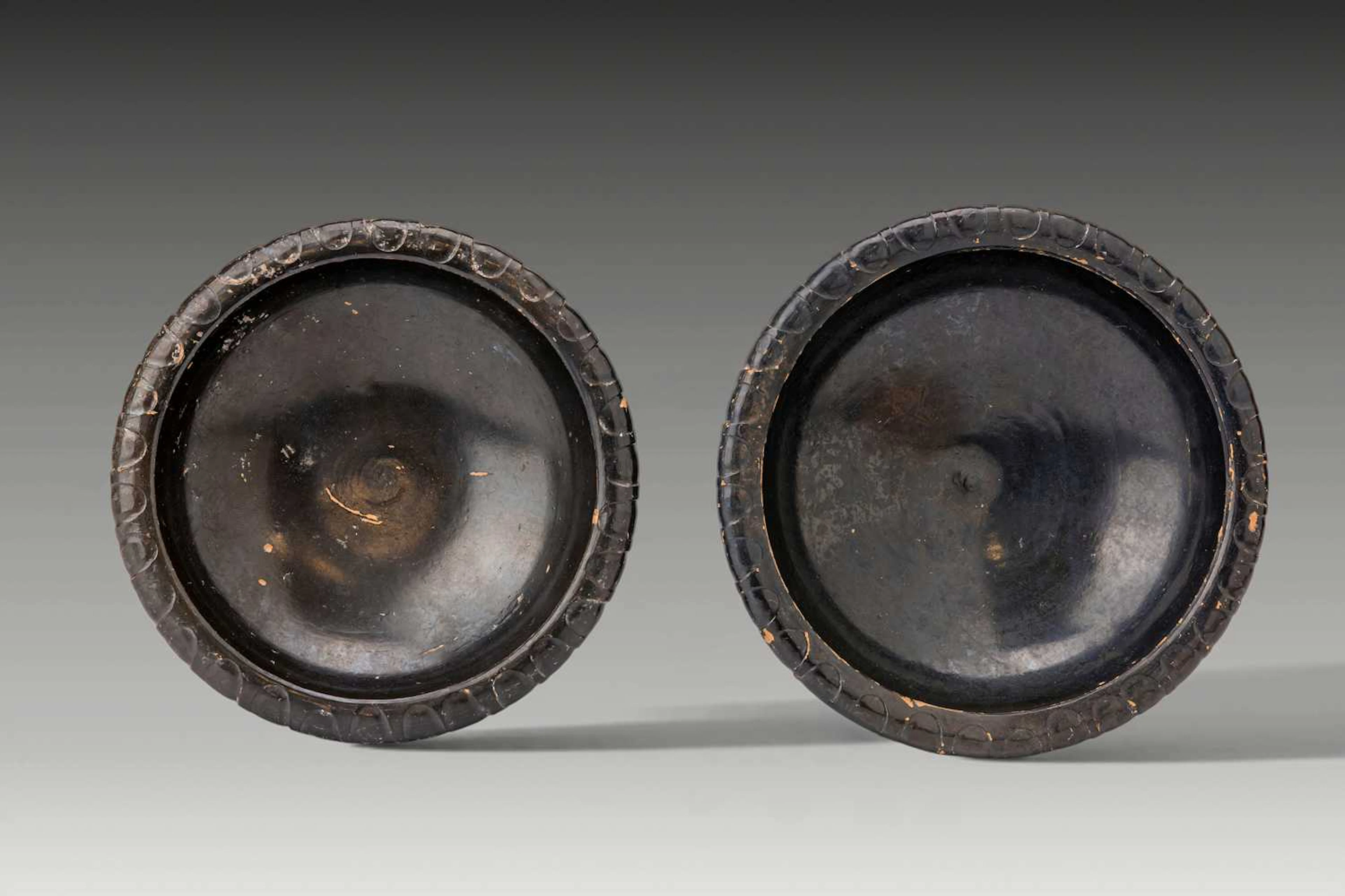 PAIR OF GREEK BLACK-GLAZED SHALLOW BOWLS