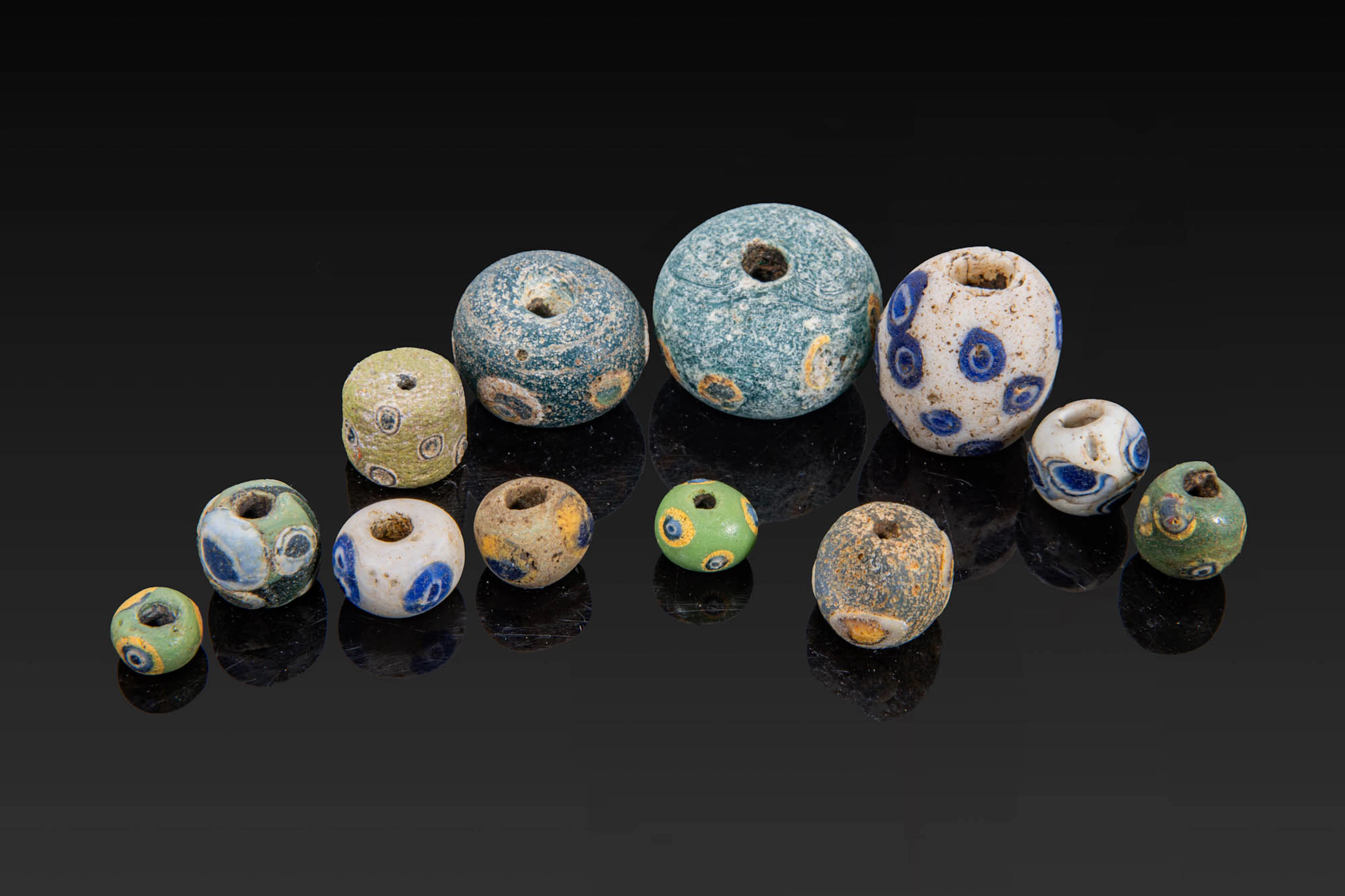 COLLECTION OF GRAECO-PHOENICIAN POLYCHROME GLASS BEADS