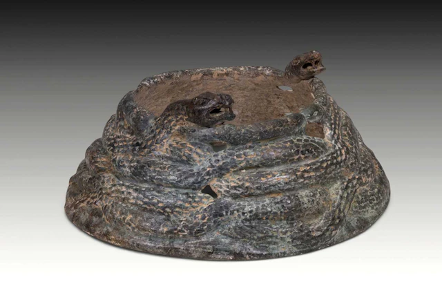RARE BACTRIAN SCHIST FITTING WITH COILED SNAKES
