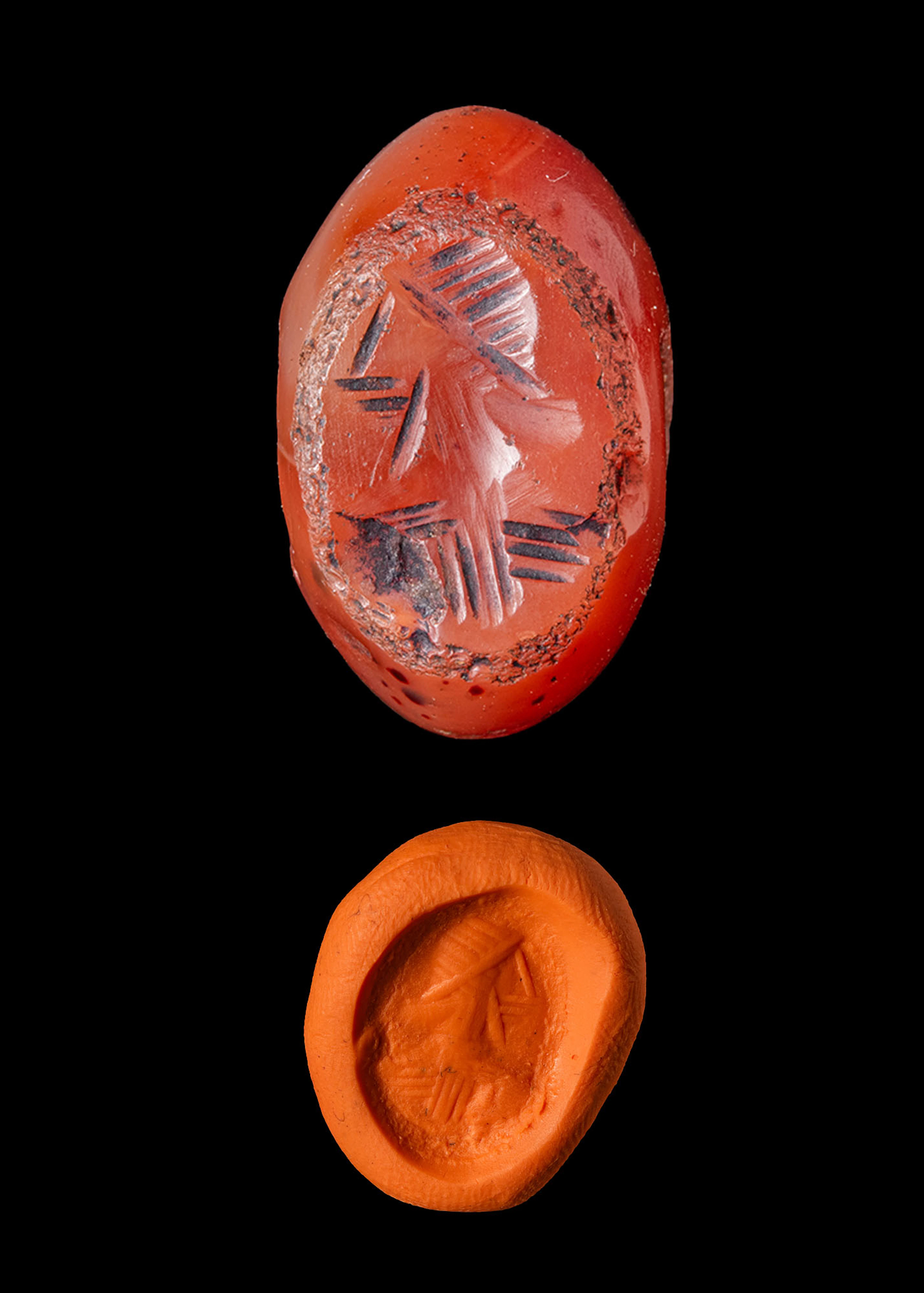 SASANIAN RED CARNELIAN STAMP SEAL ENGRAVED WITH A MALE BUST