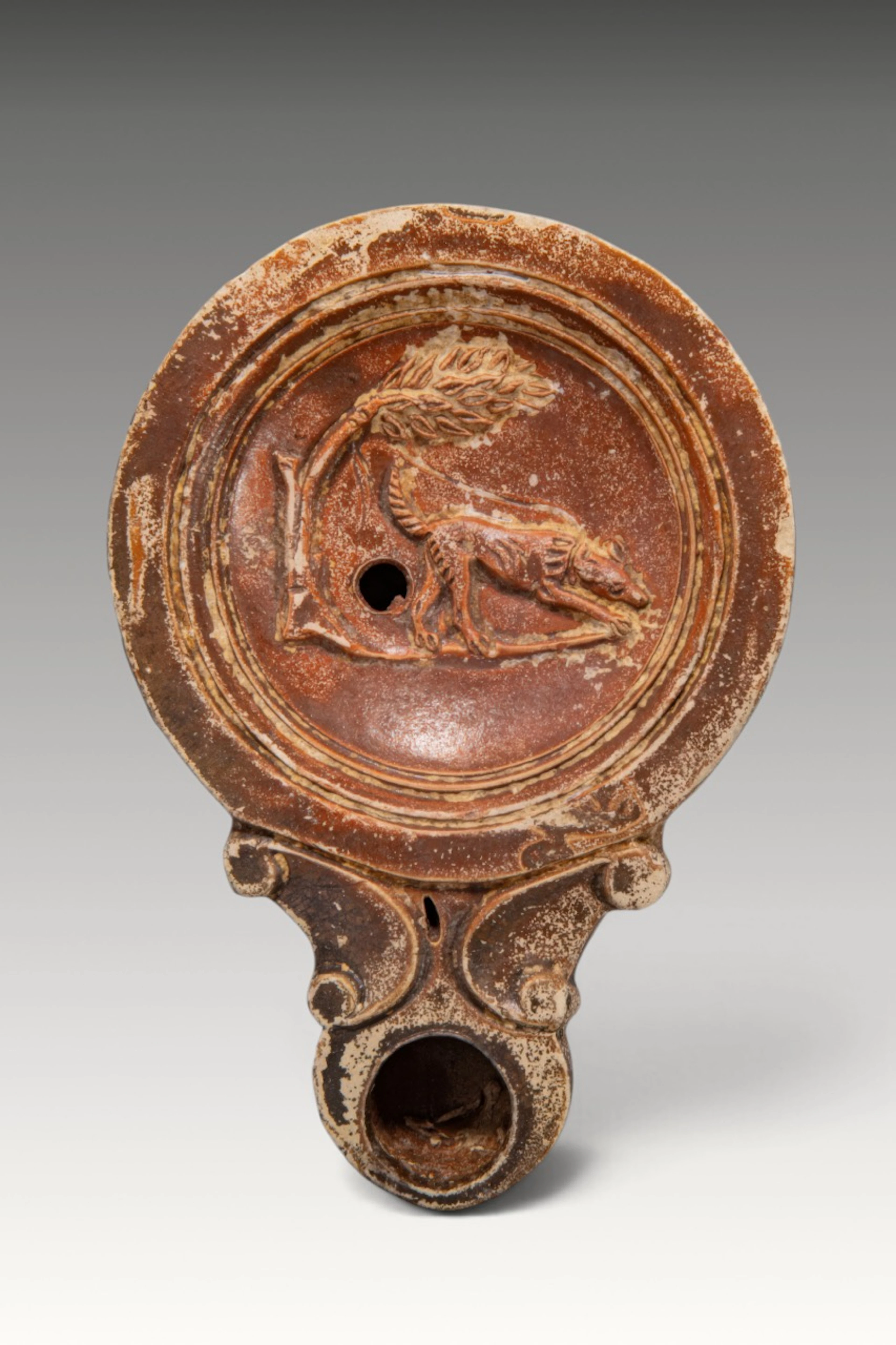 ROMAN TERRACOTTA OIL LAMP WITH A HOUND