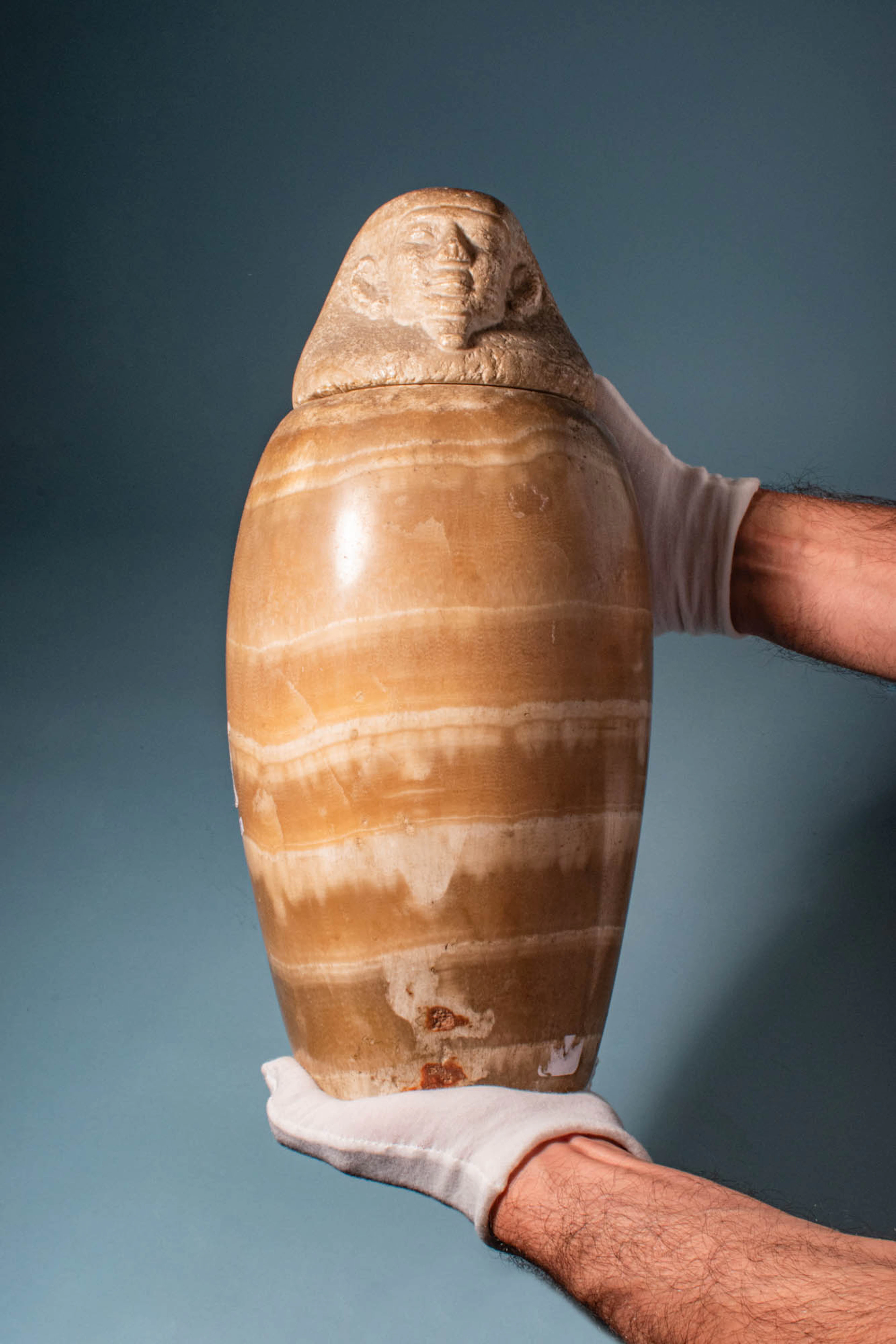 RARE EGYPTIAN ALABASTER CANOPIC JAR WITH HUMAN-HEADED LID (IMSETY)