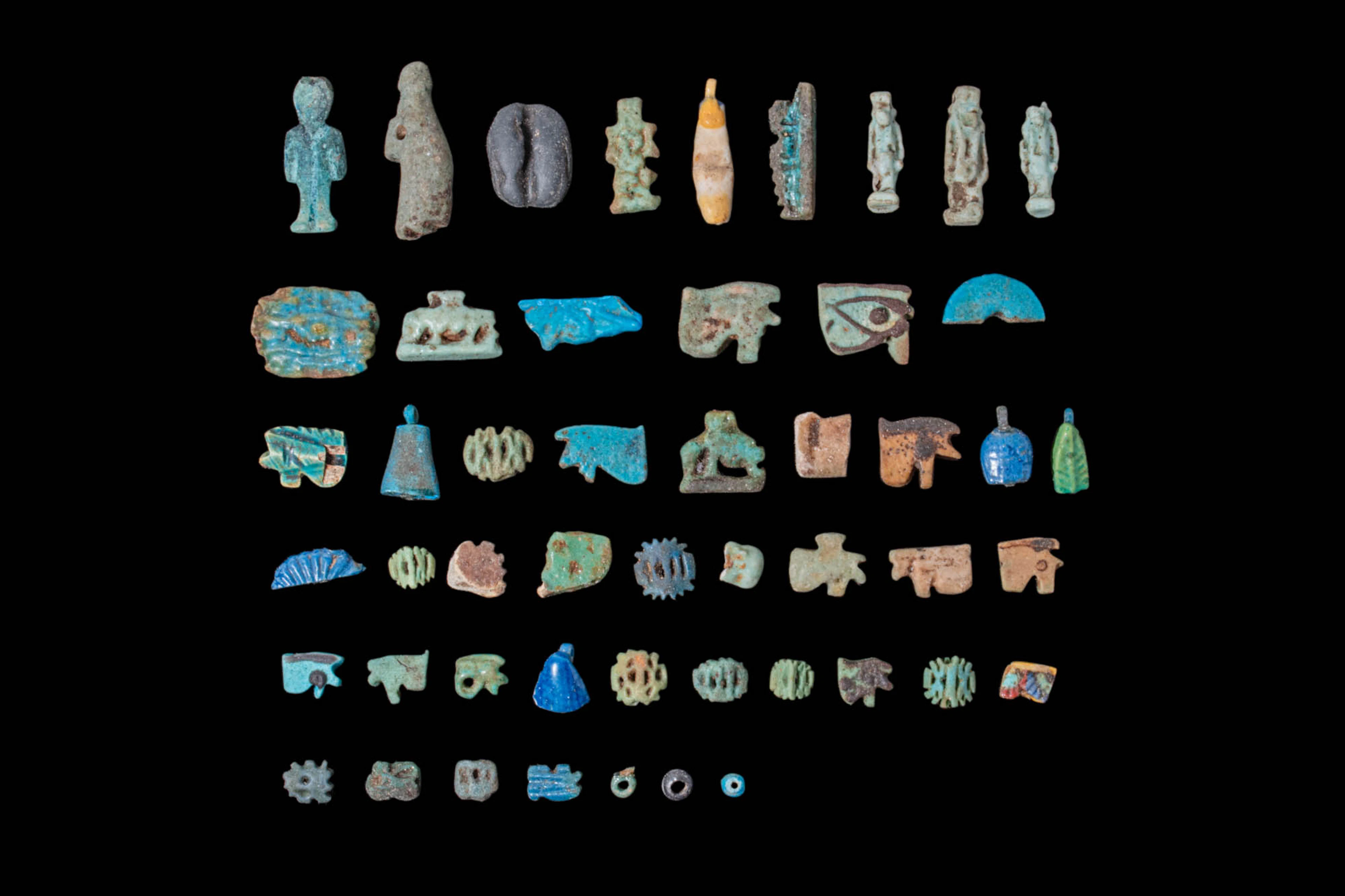 LARGE COLLECTION OF EGYPTIAN FAIENCE AMULETS