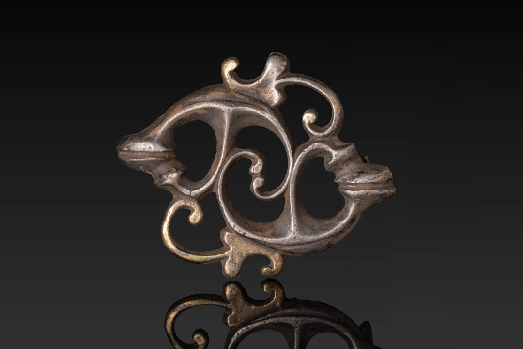 ROMAN SILVER-GILT PHYTOMORPHIC BROOCH