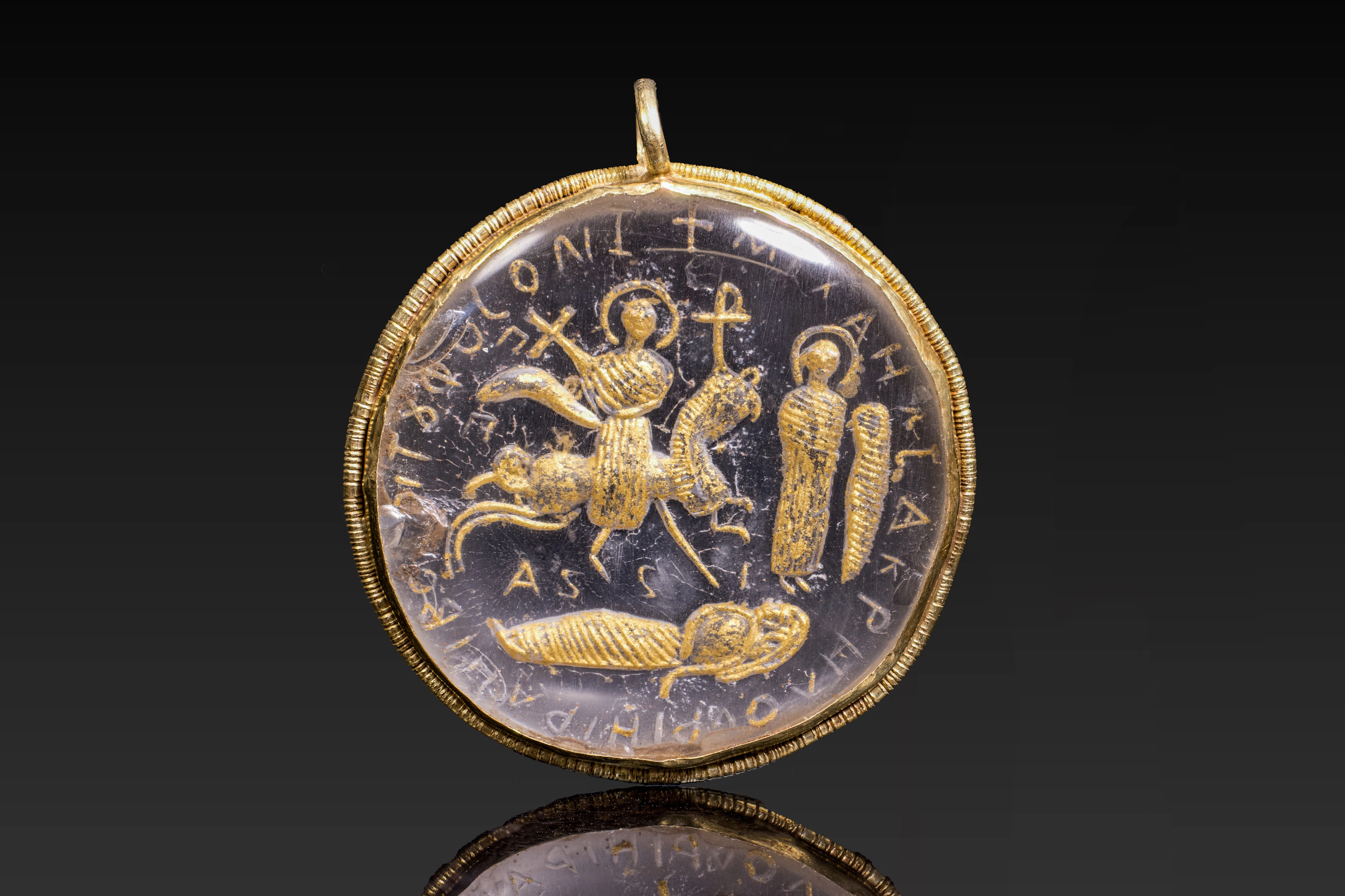 BYZANTINE ROCK CRYSTAL AND GOLD PENDANT WITH CHRISTIAN SCENE AND INSCRIPTION