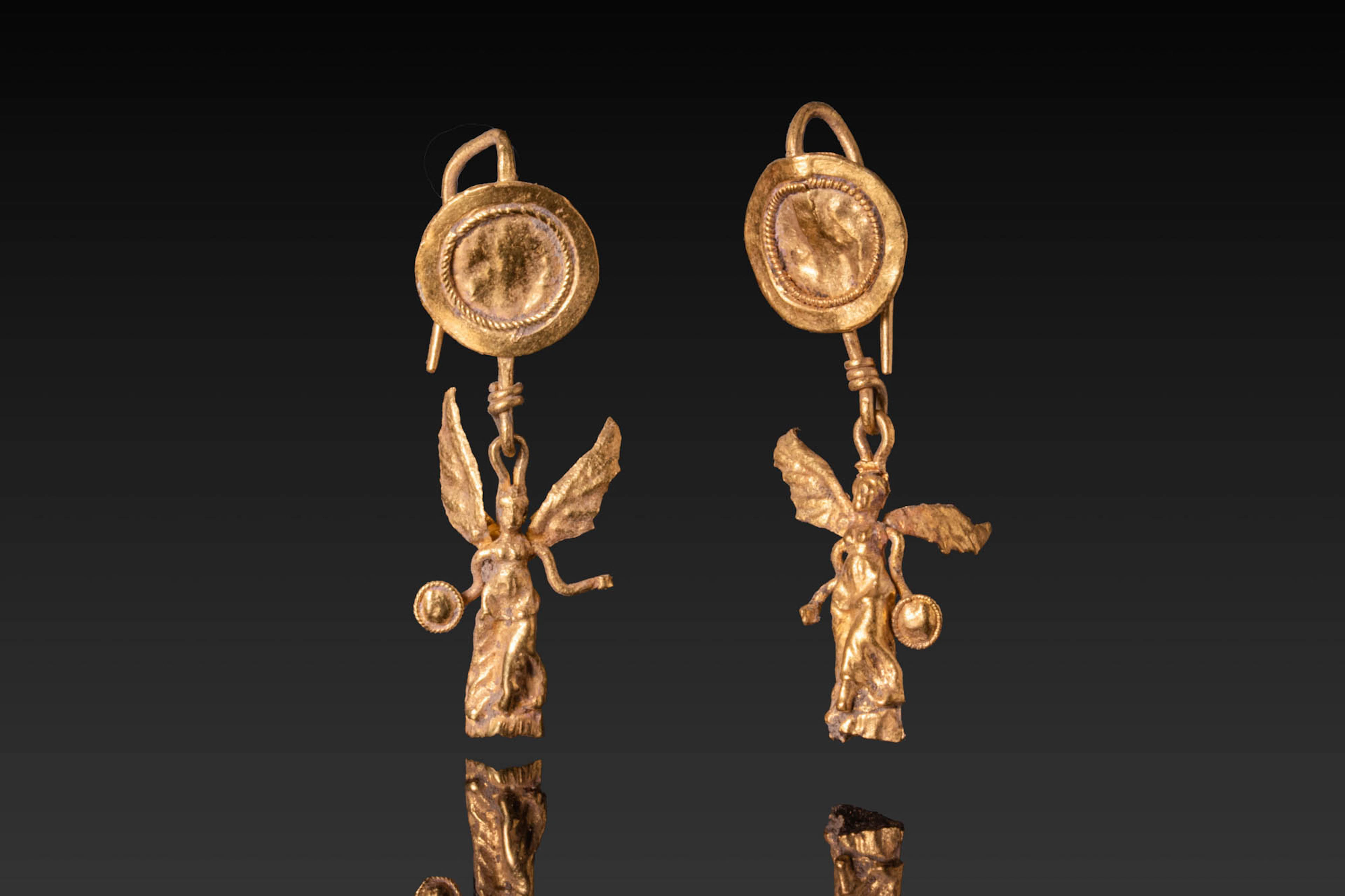 MATCHED PAIR OF HELLENISTIC HIGH KARAT GOLD EARRINGS WITH WINGED NIKE PENDANTS