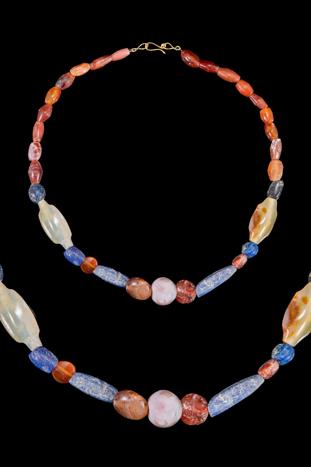 HELLENISTIC CARNELIAN, LAPIS LAZULI AND CHALCEDONY BEAD NECKLACE