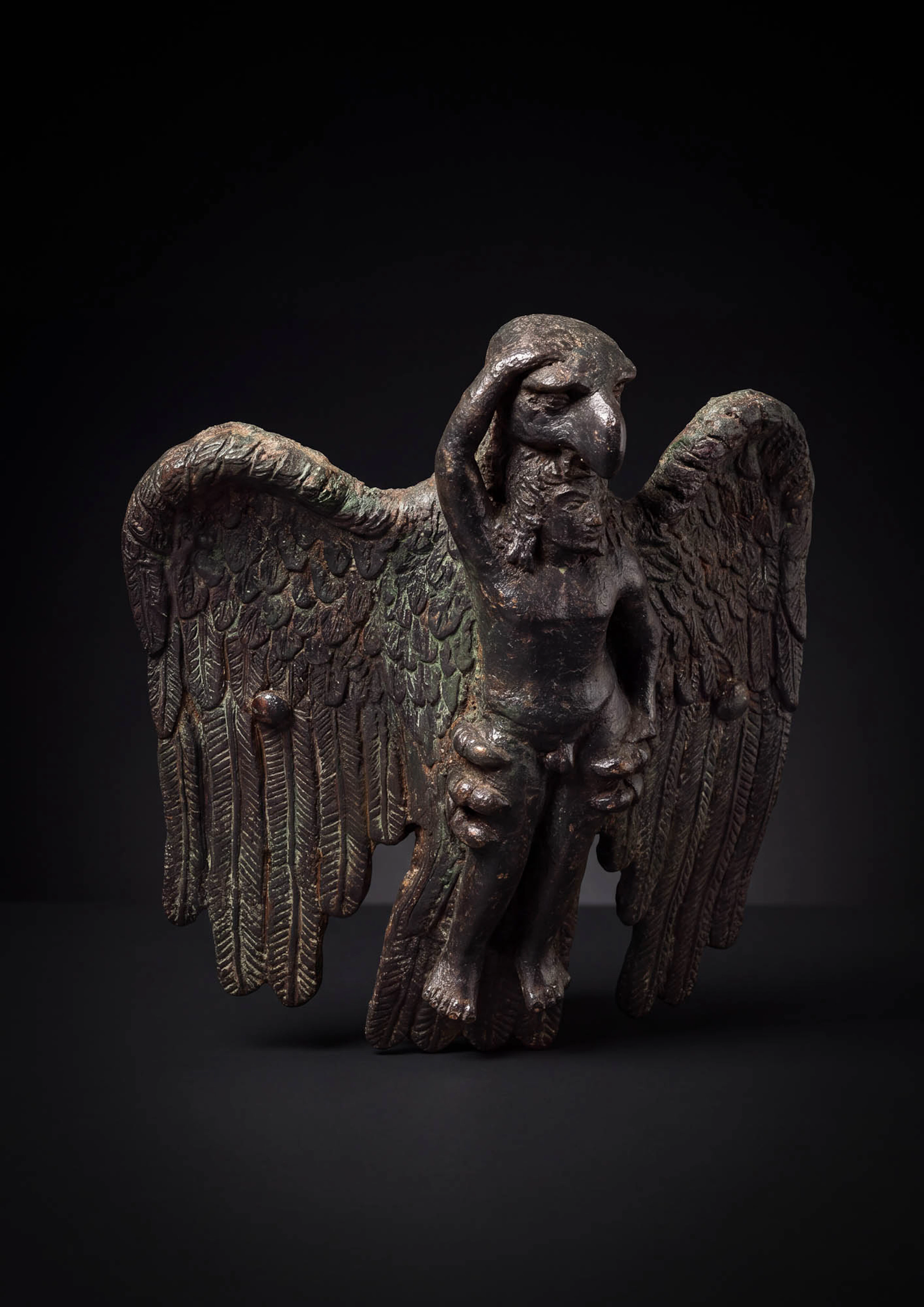 HELLENISTIC BRONZE FITTING PORTRAYING THE ABDUCTION OF GANYMEDE