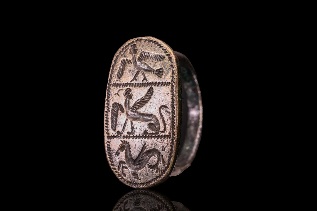 GRAECO - ETRUSCAN SILVER RING WITH MYTHOLOGICAL ANIMALS